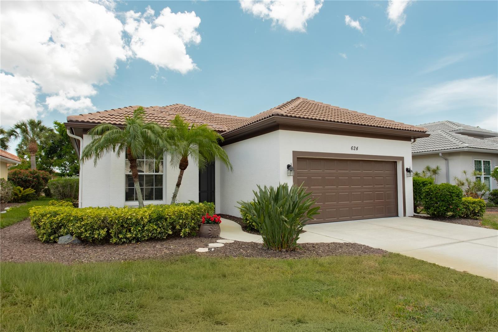 Welcome to this beautifully updated 2 bedroom, 2 bath J&J home in the highly desirable community of The Lakes of Jacaranda, Grassy Oaks II "maintenance-free" area. The open concept floor plan offers comfortable living and entertaining in a fresh and airy ambiance. The spacious primary suite provides a relaxing retreat with an en-suite bath and walk in closet. The versatile second bedroom includes a Murphy bed, perfect for guests or a home office. The updated kitchen showcases elegant quartz countertops with a large breakfast bar that flows seamlessly into the main living areas. A Florida room just off the living area overlooks a peaceful backyard, creating the perfect space to enjoy the serene outdoor setting. Additional highlights include: the roof replaced in 2024, a 2 car garage with overhead storage and a laundry tub, and low HOA fees. Residents enjoy exceptional community amenities including a community pool, tennis and pickleball courts, and scenic walking paths. Conveniently located near shopping, dining, golf and Gulf Coast beaches, this move-in ready home offers the perfect blend of comfort, style and Florida living.