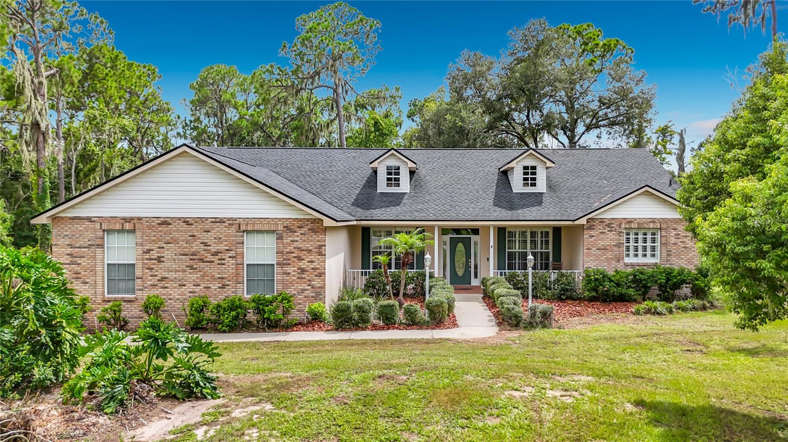 Nestled on a private 1-acre lot in Riverview’s established Shadow Run community, this spacious home offers over 2,200 square feet of comfortable living with 4 bedrooms, 2 bathrooms, and a dedicated home office. Beautiful hardwood flooring runs throughout the main living areas, creating a warm and inviting atmosphere. The open-concept kitchen features granite countertops, a center island, abundant cabinetry, a large walk-in pantry, and generous workspace, flowing seamlessly into the breakfast nook and family room. A separate formal dining room provides the perfect setting for holiday meals and entertaining. The spacious primary suite offers a private retreat with his-and-hers walk-in closets and an en-suite bathroom. A well-appointed laundry room with built-in cabinetry provides additional storage and everyday convenience. The oversized 3-car garage offers ample space for vehicles, tools, hobbies, and extra storage. Enjoy Florida living from the welcoming covered front porch or unwind on the screened rear lanai overlooking the expansive, cleared backyard with peaceful wooded views that provide both privacy and a natural backdrop. A new roof was installed in 2021, offering added peace of mind. Shadow Run is a highly desirable community known for its custom homes, large homesites, mature trees, and tranquil setting. Residents enjoy access to a private boat ramp on Lake Grady for fishing, kayaking, and recreation, while the nearby Alafia River provides direct access to Tampa Bay for boating enthusiasts. Despite its peaceful country feel, the home is conveniently located just minutes from I-75, shopping, dining, schools, and everyday conveniences. With a low HOA, a full acre of land, and the rare combination of space, privacy, and accessibility, this property is an exceptional opportunity in one of Riverview’s most sought-after communities. Schedule your private showing today.