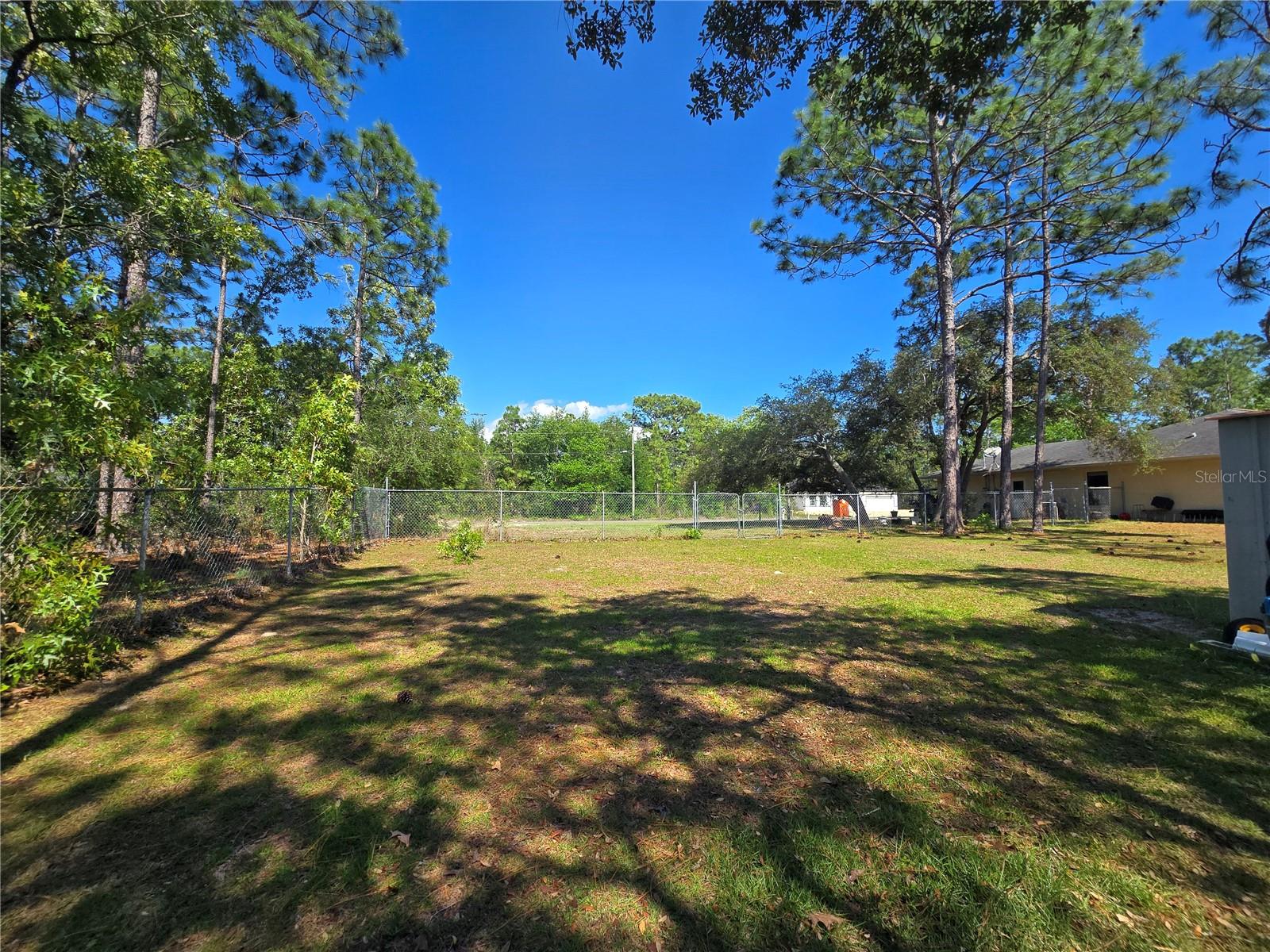 An opportunity for a cleared parcel in the desirable Citrus Springs. This one calls for public water connection, on paved road, and ready for a site built home. Free from flood hazards and backing up to a large undeveloped parcel, this homesite offers the nature coast feel while still being near the cities of Lecanto, Crystal River, and even Ocala. Looking for a place to call home? Check out the neighboring home to this parcel for a chance to have something ready with this extra yard on the side. 7630 N Galt Pt, Dunnellon FL.