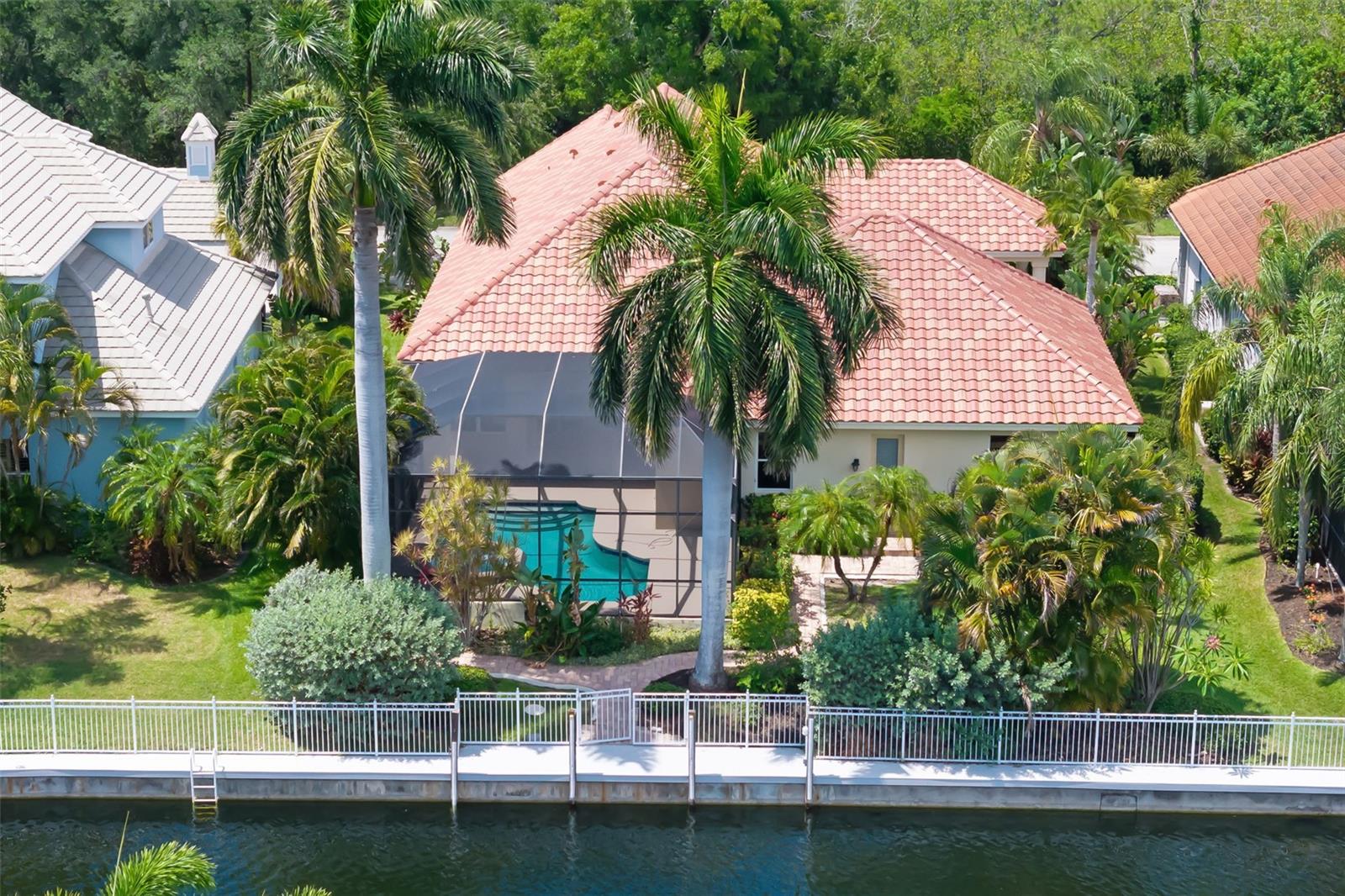 Virtually Staged. Located within the gated waterfront boating community of Harbour Walk at the Inlets 4770 Mainsail Drive offers private dock, with boating access, updated waterfront infrastructure and a private canal front setting leading to the open waters of the Manatee River, Tampa Bay and the Gulf of Mexico. Experience the pinnacle of Florida waterfront living in this exceptional Arthur Rutenberg custom-built model home, offering 3 bedrooms, 2.5 baths, a private office/den, and a NEW ROOF. Known for timeless architecture, superior craftsmanship, and thoughtful design, this residence combines elegance, comfort, and functionality in one remarkable waterfront setting. Designed for seamless indoor-outdoor living, the home features soaring ceilings, refined finishes, abundant natural light, and inviting living spaces that flow effortlessly to the outdoor entertaining areas and waterfront views beyond. Perfectly positioned on a freshwater canal with a private dock, with access to deep-water boating and the ultimate Gulf Coast boating lifestyle. Cruise the Manatee River, explore Tampa Bay, enjoy waterfront dining along the Intracoastal Waterway, or venture into the Gulf. At day's end, unwind poolside while taking in tranquil water views, tropical breezes, and spectacular Florida magenta sunsets. Harbour Walk at The Inlets is one of Bradenton's premier waterfront communities, surrounded by meandering waterways, lush tropical landscapes, and protected natural beauty. Residents enjoy nearly two miles of scenic walking and jogging trails, a 13-acre nature preserve and estuary, tennis court, kayaking, canoeing, fishing, and birdwatching. With NO CDD fees and low HOA fees, residents enjoy exceptional value just minutes from I-75, Lakewood Ranch, downtown Bradenton, Sarasota, St. Petersburg, Tampa, Sarasota-Bradenton International Airport, world-class Gulf beaches, championship golf, shopping, dining, and cultural attractions. More than a home, this is an opportunity to enjoy the best of Florida waterfront living, where boating, nature, and coastal beauty become part of everyday life in paradise.