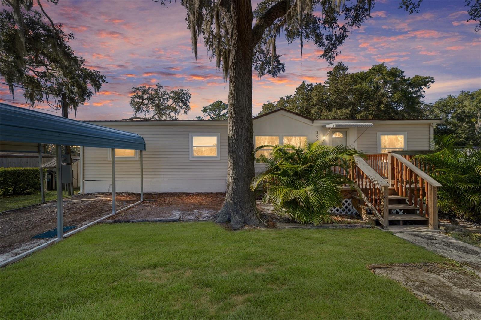 Situated on a lake with water access, this well maintained and move in ready 3-bedroom, 2 bath manufactured home offers 1,456 living square feet on nearly a half an acre (.45 acres)! Inside, you will find a comfortable split floor plan with plenty of room to relax and entertain. Outside, enjoy a yard with endless possibilities, plus a detached block garage/workshop that is perfect for hobbies, storage, or projects. Situated on a lake with water access, you will have the unique opportunity to launch an airboat and enjoy Florida's outdoor lifestyle right from your property. If you are looking for space, functionality and peaceful country living, this property is a must see!