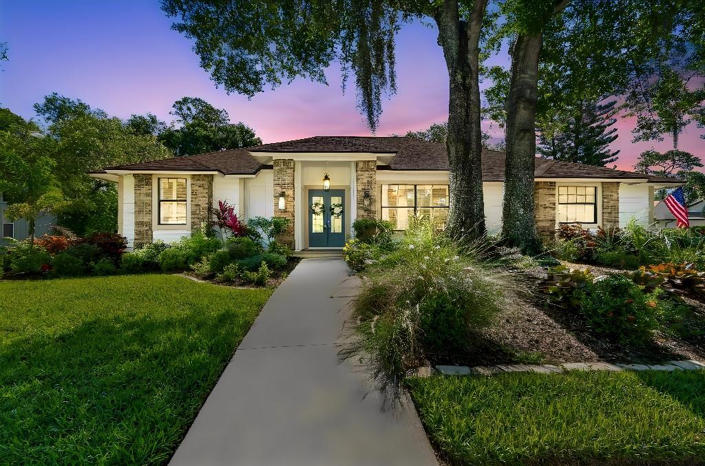 A Very Special Home with Full Renovation
An elegant path leads to the charming front porch of this beautifully renovated family home, positioned on a large corner lot amid a peaceful and lush setting in the highly desirable Lakes Estates neighborhood of Sarasota. Built by Lee Wetherington and fully renovated, this one-story open-floor plan creates an ideal balance of private and gathering spaces, with three large bedrooms, an additional fourth bedroom/office, two full baths, one half bath, formal dining and vaulted living rooms with a lovely newly updated electric fireplace and mantle. Interior and exterior painting were included in the renovation.
A neutral beachy/ocean color palette and volume ceilings create a feeling of openness, with new ceramic tile flooring throughout the home. Four sets of floor to ceiling sliding patio doors bring an abundance of light into the home. The newly renovated open kitchen is complete with stylish cabinetry and mother-of-pearl cabinet handles. Updates include a huge nine-by-five island, new natural stone counters, decorative tile backsplashes, and new stainless-steel appliances. The kitchen also boasts a large bar area with decorative upper and lower cabinets and a stainless-steel wine refrigerator. All bathrooms, laundry room, and kitchen include neutral matching natural stone countertops and new cabinetry. 
Decorative steel plantation shutters were added to the living room, bedrooms, laundry room, and primary bathroom. New light fixtures, chandeliers, and fans were replaced throughout the interior and exterior of the home. Step outside and you will find an oversized screened lanai and private pool, all enveloped by lush Floridian foliage. Complete repainting of the interior and exterior of the home was completed. A new pool deck and a saline system, pool pump, and pool heater were included in the recent renovation. 
A two-car, side-entry garage with new epoxy floor coating and extra storage space completes the picture of relaxed living. Extensive landscaping was included in the renovation of this home. The Lakes Estates is a highly desirable Sarasota community with a low monthly HOA fee, offering canopied sidewalks and rich landscaping. Residents enjoy a lakeside pool, fitness center, clubhouse, and tennis courts, all within easy reach of Gulf Coast beaches, restaurants, shopping, and cultural attractions. The house may be purchased as furnished and turn-key or unfurnished.