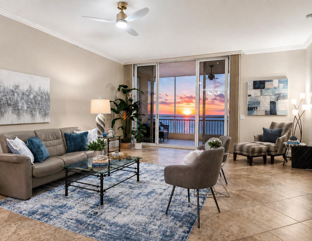 PENTHOUSE WATER VIEWS | Furnished | Private Garage | Bay Club Value. Discover space, views, and lifestyle at a price point that stands out along the Gulf Coast.  Experience elevated living in this PENTHOUSE residence featuring breathtaking WATER VIEWS of Terra Ceia Bay, the iconic Sunshine Skyway Bridge, and the skyline of St. Petersburg. This spacious 3 BEDROOM + DEN/OFFICE | 2.5 BATH home offers a desirable SPLIT FLOOR PLAN, soaring 10-FOOT CEILINGS, and an open-concept layout designed for both everyday comfort and effortless entertaining.  The main living area flows seamlessly to an EXPANSIVE PRIVATE BALCONY, where you can enjoy peaceful mornings and unforgettable sunsets over the water. A dedicated DEN/OFFICE WITH BUILT-IN DESK provides the perfect space for working remotely or relaxing with a good book.  Thoughtfully refreshed with NEW LIGHTING, FRESH INTERIOR PAINT, UPDATED BALCONY SCREEN, NEWER APPLIANCES, and PRIMARY BEDROOM CARPET, this residence is PROFESSIONALLY STAGED AND OFFERED FURNISHED (STAGING ITEMS EXCLUDED)—making it easy to move right in and start enjoying the Florida lifestyle. The PRIMARY SUITE offers a serene retreat, while the open living and dining areas are perfectly positioned to take in the stunning views. A rare and valuable feature, this PENTHOUSE INCLUDES A PRIVATE GARAGE.  Located within the gated BAY CLUB AT TERRA CEIA GOLF COMMUNITY, residents enjoy access to resort-style amenities including a POOL, SPA, FITNESS ROOM, TENNIS COURTS, 500-FOOT FISHING PIER, and scenic nature trails. The clubhouse features dining, social events, and a lively tiki bar, with OPTIONAL GOLF MEMBERSHIP and pay-to-play access available.Ideally situated near downtown Palmetto and Bradenton, with convenient access to St. Petersburg, Sarasota, and Tampa International Airport, as well as waterfront dining, shopping, and Gulf beaches. Enjoy weekends at the Bradenton Farmer’s Market or take the nearby ferry for easy access to the islands. PENTHOUSE LIVING WITH WATER VIEWS, GENEROUS SPACE, AND EXCEPTIONAL VALUE—A STANDOUT OPPORTUNITY ON FLORIDA’S GULF COAST.