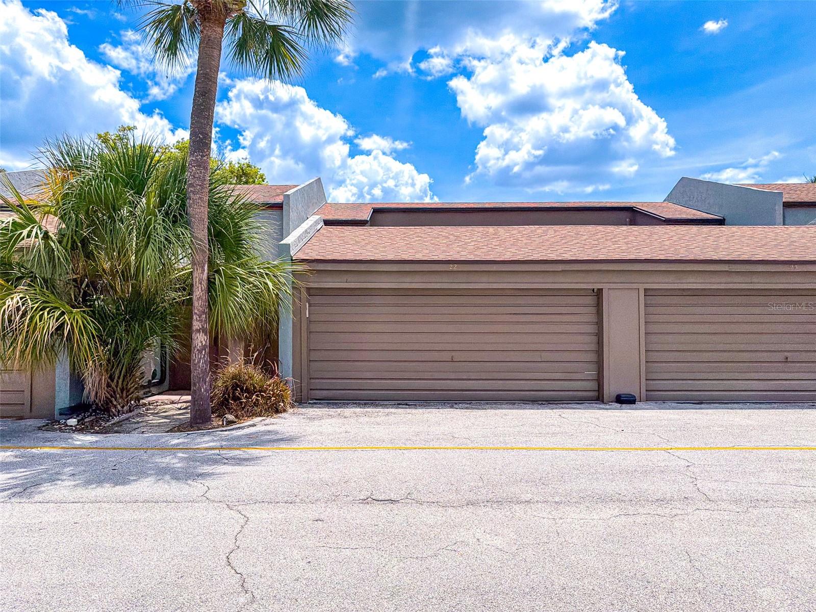 Welcome to easy Florida living at this beautifully updated 2-bedroom, 2.5-bath townhome with a rare 2 CAR GARAGE in the desirable Casa Del Sol community of Winter Haven. Offering direct views of the community pool and multiple outdoor living spaces, this home combines comfort, convenience, and a low-maintenance lifestyle in one attractive package.

As you enter, you'll find a versatile flex space that can easily serve as a dining room, home office, reading nook, or additional sitting area. This inviting space features access to a private front patio, creating the perfect setting to enjoy your morning coffee. The updated galley-style kitchen showcases modern white cabinetry, granite countertops, stainless steel appliances, and ample storage, providing both style and functionality. The spacious living room features attractive laminate flooring and sliding glass doors that lead to the screened rear patio, creating a seamless indoor-outdoor flow ideal for entertaining or everyday living. A convenient half bath and a full laundry room add functionality and convenience to the first floor.

Upstairs, both bedrooms provide privacy and comfort. The spacious primary suite serves as a relaxing retreat, complete with a large walk-in closet, a private bathroom with a tub, and access to a PRIVATE BALCONY overlooking the sparkling community pool. Enjoy peaceful mornings or unwind in the evenings while taking in the tranquil pool views from your own bedroom. The second bedroom offers flexibility for guests, family members, or additional workspace.

The screened rear patio provides another wonderful outdoor living area and is perfectly positioned just steps from the community pool. Whether you're entertaining guests or simply enjoying Florida's beautiful weather, this space offers the ideal place to relax. Additional peace of mind comes from the 2020 air conditioning system.

Residents enjoy access to community amenities including a swimming pool, shuffleboard courts, exterior maintenance services, sewer, trash service, and beautifully maintained grounds. Conveniently located in the heart of Winter Haven, this home is just minutes from downtown Winter Haven, the Chain of Lakes, shopping, dining, medical facilities, and LEGOLAND Florida Resort. Whether you're looking for a primary residence, seasonal getaway, or investment opportunity, this move-in-ready townhome offers an exceptional combination of location, lifestyle, and value.