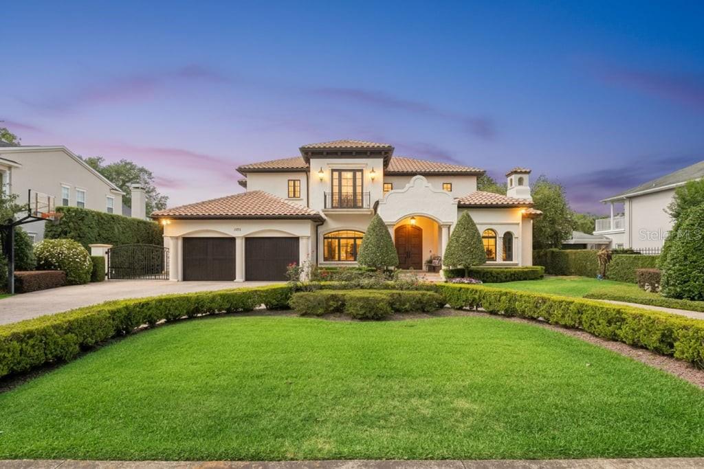 Experience timeless elegance and deliberate craftsmanship in the heart of prestigious Winter Park. This one-of-
a-kind exceptional estate offers more than 7,300 square feet across three beautifully designed levels, blending
refined luxury with modern comfort.
Rich architectural details include solid red oak flooring with a walnut finish, nearly 10-foot ceilings, stacked
crown moldings, custom ironwork, designer lighting, and extensive millwork throughout. The gourmet kitchen is
thoughtfully appointed with Viking and GE Monogram appliances, custom Busby cabinetry, an oversized island,
and a butler’s pantry. It also includes multiple filtered water and ice zones designed for effortless entertaining.
The spacious primary suite offers a true retreat with spa-inspired marble finishes, an oversized walk-in shower, a
jetted soaking tub, and exceptional custom closet space.
Additional features include a private elevator, Control4 automation, integrated audio/video/security systems,
five HVAC systems, a central vacuum system, and a Generac whole-home generator.
A fully finished and expansive basement level serves as a unique and exceptional extension of the home’s living
and entertaining space. Designed for both relaxation and recreation, it features a game and arcade room, a full
beverage center with a dishwasher, microwave, and Scotsman ice machine, a fitness area with a sauna and
steam room, an additional laundry room, a creative storage center, and a private 4K theater with seating for
multiple guests.
Outdoors, resort-style living awaits with a saltwater pool and spa, a summer kitchen with a custom copper hood,
an electric gated entry, landscape lighting, lush cascading bougainvillea, and ten mature magnolia trees creating
exceptional beauty and privacy. The property also features a dog run with artificial turf.
Three ventless gas fireplaces, including one on the private covered porch, add warmth and ambiance
throughout the home. This home also features a whole-house water softener system.
Top-rated A+ public schools are within a short walk or bike ride. Nearby highly regarded private schools include
Park Maitland School, The Christ School, The First Academy, Trinity Preparatory School, Lake Highland
Preparatory School, and Bishop Moore Catholic High School.
Perfectly positioned within walking distance of the boutiques and dining of Park Avenue, and just minutes from
the Winter Park Golf Course, Rollins College, and Advent Health Winter Park, this is a rare opportunity to own an
exceptional custom estate in one of Central Florida’s most sought-after communities.