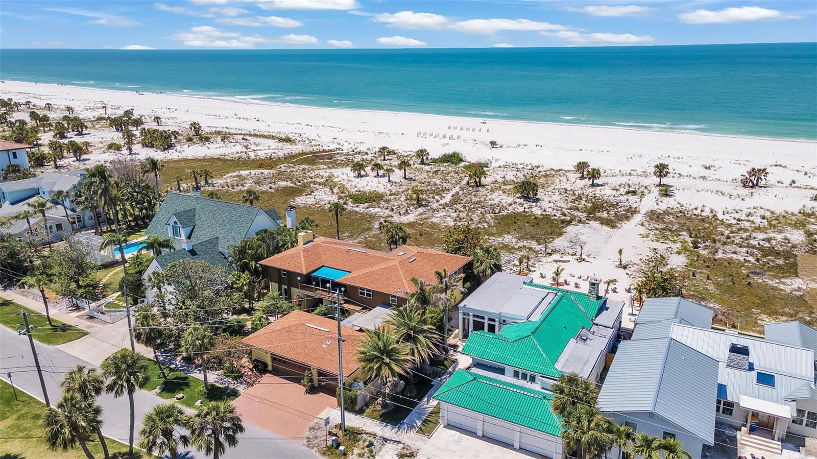 LARGEST Gulf-Front Lot Offered For Sale in Nearly 4 Years! With Gulf views in the back, and Bay views in the front, makes this an extremely rare opportunity on Clearwater Beach's coveted North Beach. Located on the most desirable part of Eldorado Avenue, and directly across from the exclusive Carlouel Yacht Club. This oversized lot (11,117 sqft) boasts 90 feet of frontage on the stunning Gulf of Mexico—significantly larger than most neighboring properties. This prime location offers breathtaking views and endless potential. The existing 5,000+ sqft home includes 6 BR (one bedroom can double as office) + Den/Playroom and 5 BA. The home is offered as-is, making it the perfect canvas on one of North Beach's finest streets. Upper Floor: Fully Intact; Only the lower level sustained flood damage from Hurricane Helene. The upper floor bedrooms, bathrooms, and structural integrity are entirely unaffected — meaning a buyer receives full value of the existing 5,000+ sq ft layout with targeted, lower-level remediation only. Two visions: One exceptional address. Whether you are drawn to the beauty of preserving a well-built family home or envision raising a custom estate from the ground up, 1058 Eldorado accommodates both with equal distinction. PATH ONE: Restore & Revitalize- Honor the home's heritage while modernizing to today's luxury standards. With only the lower level requiring attention, the cost to create a stunning, turn-key Gulf-front residence is a fraction of new construction — and faster. PATH TWO: Blank Slate. Dream Home. A 90-foot Gulf-front lot is the rarest commodity on Clearwater Beach. Cleared and redeveloped, this parcel supports a $6–8M+ custom estate — one designed precisely for the buyer's vision, maximizing views, setback advantage, and luxury programming. STRATEGIC POSITION: Set back. Elevated. Protected. What might appear as "distance from the water" is, in fact, this property's most under appreciated advantage. Sitting approximately 500 feet from the high tide line, 1058 Eldorado occupies a rare position: genuinely Gulf-front, yet buffered by one of Florida's broadest natural beach corridors— unobstructed views, natural privacy through depth, and a property that has consistently attracted interest precisely because it sits at the apex of North Beach. THE VIEWS: Two bodies of water. One address. Dual-water-view properties on Clearwater Beach are exceptionally rare. 1058 Eldorado delivers both — Gulf of Mexico sunsets from the rear and serene Intracoastal/Bay views from the front. This is a view composition that no standard lot can replicate. Carlouel Beach and Yacht Club: $45M+ MEMBER-APPROVED REBUILD BUDGET
"Carlouel is entering an exciting new era — a complete clubhouse rebuild designed to honor its storied history while reimagining the future of private coastal living."