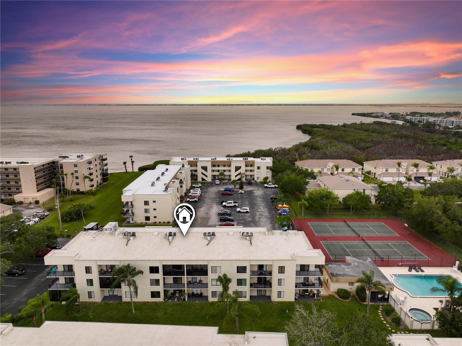 Quiet top-floor, well maintained condo in Cape Canaveral — all special assessments paid in full. Situated between the Banana River & Atlantic Ocean, less than 1 mile walk to the beach, unit 716 is refreshed with a modern aesthetic: fresh paint, new vinyl plank flooring, and a fully updated bathroom. Convenient in-unit washer/dryer hookups and smart thermostat. The upgraded no-see-sum screened patio is a private retreat. Building 7 is the closest to the resort-style amenities: heated pool, sauna, hot tub, and tennis courts with pickleball lines. Bike and canoe racks round out the active lifestyle this community offers with the ability to launch kayaks at the Banana River. HOA covers the unit's water, roof replacement (2022), trash, exterior maintenance, and access to amenities — making this an ideal lock-and-leave second home, hassle-free primary, or income-producing investment (30 day minimum STR). Located near Port Canaveral, Jetty Park, free beach parking & access, and the restaurants/shops of the Space Coast. Kennedy Space Center is just up the road. To see more, WATCH THE VIDEO TOUR!