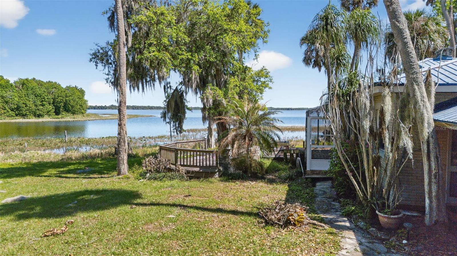 Exceptional opportunity featuring over 700 linear feet of lakefront in a rare Old Florida natural setting on Lake Marion.
Privately owned by the same family for four generations, this remarkable 18.75-acre lakefront property offers endless possibilities for use, investment, or development. Originally settled in the late 1890s, this historic Haines City property represents a truly unique offering with deep local roots.

The property may be enjoyed as a private lakefront estate on Lake Marion, continued in its historic use as a revenue-generating fish camp alongside a lakefront estate home, or repositioned as a prime development opportunity in one of Polk County’s fastest-growing cities.

An existing residence on the property has withstood multiple hurricanes and features poured concrete walls, a fortified brick exterior, and a metal roof installed in 2010. The covered boat dock has two slips that can easily house twenty five foot boats. The home is well-suited for use as a guest house or interim residence while constructing a new lakefront estate.

This offering includes a lakefront lagoon business opportunity with multifamily-zoned parcels (Zoning Code 0803 – SFR & MH)