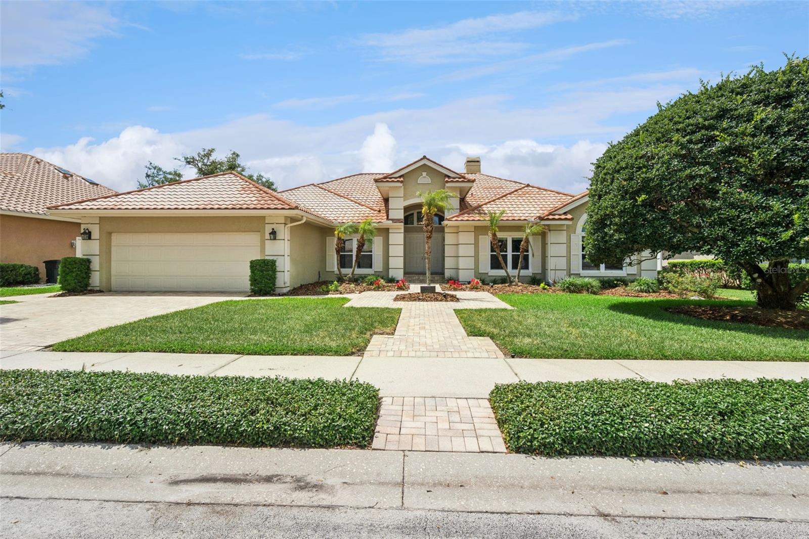 One or more photo(s) has been virtually staged. Located within the highly desirable Heathrow community and perfectly positioned on Hole #7 of the golf course, this exceptional 4-bedroom, 3-bathroom pool home offers luxury living in one of Central Florida’s premier gated neighborhoods. A pavered brick driveway and walkway welcome you to the home, leading to impressive double front entry doors. Inside, you’ll find a dedicated office, formal dining room, spacious living areas, LED lighting throughout, brand-new interior paint, updated light fixtures, and a thoughtfully designed floor plan ideal for both everyday living and entertaining. Major recent improvements include a brand-new main A/C system, new water heater, water softener, and double-pane windows throughout. The completely remodeled 2024 kitchen is beautifully appointed with quartz countertops, custom cabinetry, tiled backsplash with under-cabinet lighting, a large center island with eat-in seating, additional breakfast space, coffee bar, wet bar, pantry, and GE Café stainless steel appliances including an induction cooktop, double ovens, microwave, dishwasher, refrigerator, and advantium oven. The oversized laundry room offers exceptional functionality with built-in upper and lower cabinetry, a large utility sink, storage closet, and new LG washer and dryer set. The private primary suite features direct lanai access through elegant doors and a beautifully updated bathroom with dual vanities, a freestanding soaking tub, oversized walk-in shower, and an expansive custom walk-in closet with built-in organization.  Step outside to your private screened pool and spa retreat featuring a brand-new pool screen, spa, gas availability for grilling, full pool bath access with shower, and peaceful golf course and water views that create the perfect backdrop for relaxing or entertaining guests. The air-conditioned oversized three-car garage includes a convenient side-entry golf cart door along with an included garage refrigerator/freezer, adding both comfort and practicality. Residents of Heathrow enjoy 24/7 guarded gate access along with an abundance of community amenities including parks, playgrounds, basketball courts, soccer fields, and scenic walking trails. Optional membership to Heathrow Country Club provides access to championship golf, tennis, fitness facilities, and a resort-style pool. Conveniently located near I-4, SR-417, top-rated Seminole County schools, shopping, dining, and entertainment.