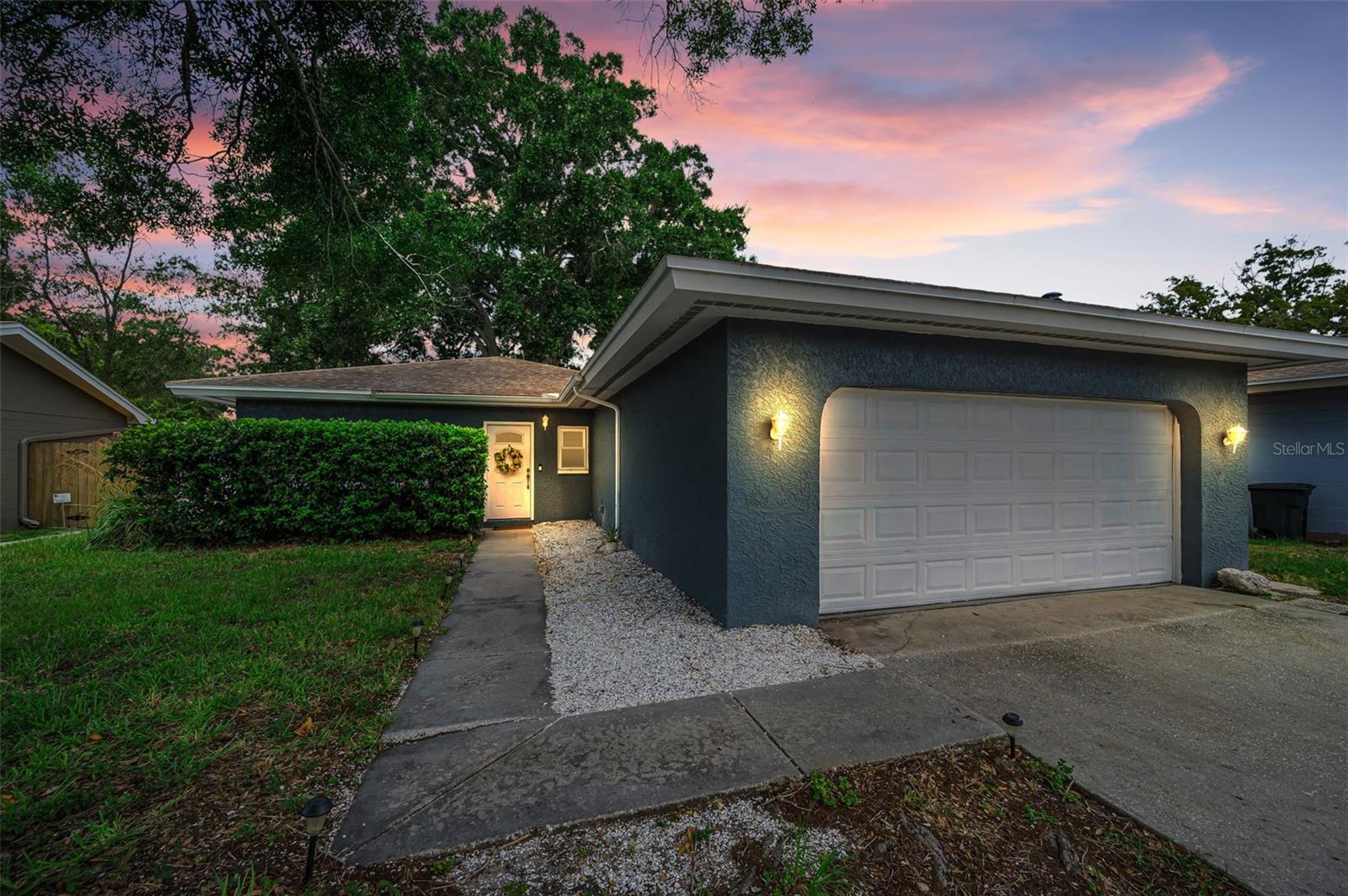 Welcome to this desirable single-family home in the heart of Palm Harbor’s highly sought-after Beacon Groves subdivision.  This Updated 3-bedroom, 2-bath property includes low maintenance engineered hard wood, laminate and tile tough out. No flood insurance required (86’ above sea level), and an unbeatable location this home truly stands out. From the moment you arrive, the curb appeal is undeniable. Inside, you’ll find an inviting open-concept floor plan designed for both comfort and entertaining. The kitchen features a large island with seating while the adjoining dining room provides additional space and opens directly to the backyard. The outdoor living area is designed for gatherings and Florida-style entertaining, with a large, fenced yard, expansive patio, while the privacy fence creates a secure environment for pets and play. Inside, the primary suite includes a walk-in closet and en suite bath with walk-in shower. Two additional bedrooms give space for many options. All of this comes with the added benefit of being zoned for top-rated Palm Harbor schools, with convenient access to US 19, Belcher Road, downtown Palm Harbor, shopping, dining, and Gulf beaches. Move-in ready and full of charm, this property is the perfect opportunity to own your own slice of paradise in Palm Harbor. This property is ready for you to move in and start creating wonderful memories. Don’t miss this opportunity to make this lovely house your home.