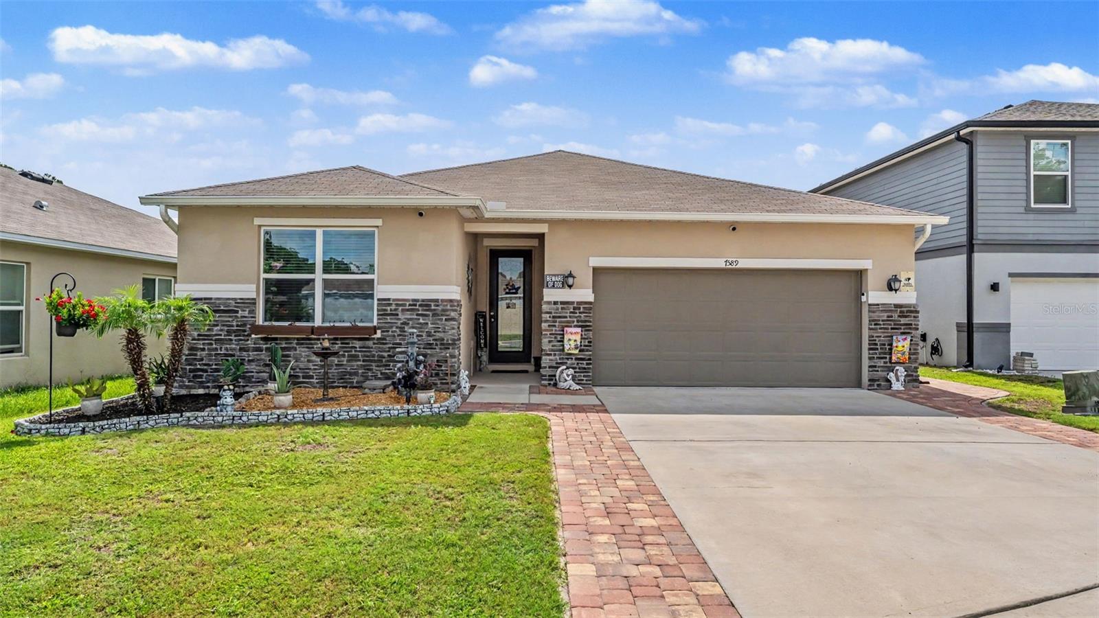 MOVE IN READY and Loaded with Upgrades! From the moment you step through the front door, you'll be impressed by the soaring ceilings, open layout, and luxury vinyl plank flooring that flows seamlessly throughout the home. The chef-inspired kitchen is designed for both everyday living and entertaining, featuring built-in oven and microwave, a large center island with sink, abundant cabinetry, and a spacious walk-in pantry. The versatile den is currently set up as a theater room but could easily be converted into a fourth bedroom, home office, or flex space to fit your needs. Retreat to the oversized owner's suite, offering plenty of room for a sitting area, desk, or exercise space. The custom California Closet provides exceptional storage and organization, while the spacious ensuite bath features a large walk-in shower and convenient linen closet. Step outside to your private Florida paradise. The expansive screened lanai is built for entertaining with a fully equipped outdoor kitchen complete with built-in grill and sink, plus a relaxing 7-person jacuzzi. Whether you're hosting friends or enjoying a quiet evening at home, this outdoor space is sure to impress. For added peace of mind during Florida storm season, the home is wired for a generator. Located in desirable Cayden Reserve, this meticulously maintained home combines luxury, comfort, and functionality. All that's missing is you!