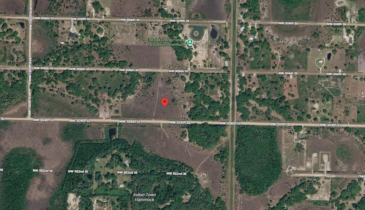 Build your dream home or invest in your own piece of Florida with this partially cleared vacant lot in the peaceful Viking/Prairie community of Okeechobee. With a portion of the clearing already completed, you'll save time and expense while still enjoying the flexibility to customize the property to fit your vision. This rural setting offers plenty of room for a home, workshop, RV, recreational vehicles, and more. No HOA and no required time frame to build. Please note: While the property has an assigned address of 15463 NW 306th Street, the lot is physically located on NW 304th Street, making access convenient from the maintained roadway. Buyer to verify zoning, land use, utilities, wetlands, and all building requirements during their due diligence. Don't miss this opportunity to own affordable land in one of Okeechobee's growing rural communities!