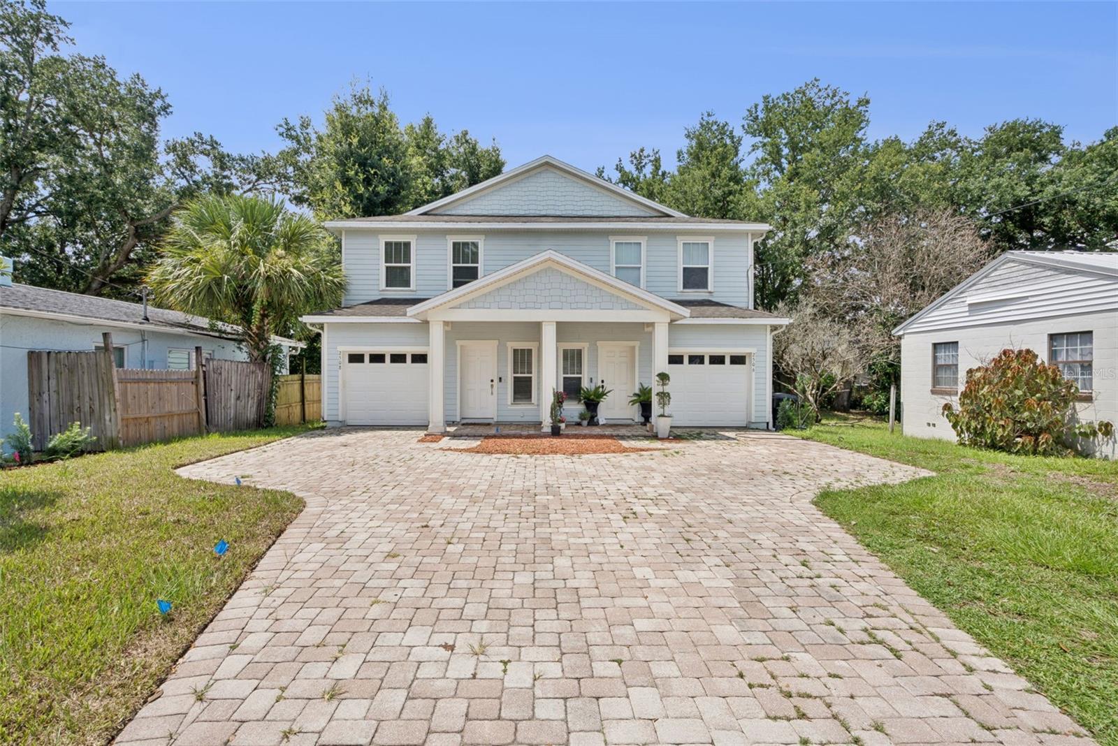 Welcome to one of Orlando’s most vibrant and connected neighborhoods, where the energy of city living meets the charm of an established residential community. Located in the heart of the Milk District, this home places you minutes from colorful murals, local coffee shops, breweries, live music, unique boutiques, and longtime local favorites. Built in 2016, this charming 3-bedroom, 2.5-bathroom townhome offers great curb appeal with coastal-inspired siding, a pavered driveway, and a covered front porch that provides a warm welcome. An attached 1-car garage adds everyday convenience. Stepping inside, the foyer opens to an inviting interior where hardwood flooring and crown molding flow throughout the first floor. The open-concept floor plan allows the living room to connect seamlessly with the dining area just off the kitchen, creating a comfortable space for everyday living and entertaining. The kitchen features granite countertops, ample barstool seating, stainless steel appliances, recessed lighting, and generous cabinet space. A first-floor powder room is perfectly positioned for guests. Upstairs, the spacious owner’s suite features a tray ceiling, walk-in closet, and private ensuite bathroom with dual sinks set in granite, a large soaking tub, and a separate glass-enclosed shower. Both additional bedrooms are generously sized, while another full bathroom and an upstairs laundry area provide added convenience. French doors lead outside to a pavered patio overlooking the private, fully fenced backyard. An additional pavered area offers the perfect setting for a firepit, outdoor seating, or evenings spent entertaining under the stars. Spend the morning beneath the mature oaks at nearby Langford Park, enjoy dinner and drinks in Thornton Park, or head to Lake Eola for the farmers market, festivals, and a stroll around the lake. Downtown Orlando, the Dr. Phillips Center, Kia Center, Mills 50, Audubon Park, and Baldwin Park are all within easy reach, while convenient access to SR 408 makes commuting throughout Central Florida a breeze. With its private entrance, attached garage, spacious layout, and impressive backyard, this one-of-a-kind property truly feels more like a single-family home than a townhome.