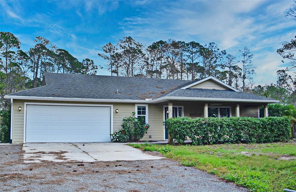 USDA Eligible – 100% financing available to motivated qualified buyers! Bring little to possibly no money down! Do you desire privacy, nature, and NO HOA fees? If so, don’t hesitate as this could be your dream home. This home sits on 2.9 acres of conservation land kept in its natural state, wooded. As you drive up to this 3 bedroom 2 bath home you will be greeted by warmth of this home with its cozy front porch. Grab your rocking chairs and take a break enjoying the quietness of the neighborhood. But don’t get to comfy, proceed inside to enjoy the generous open floor plan, natural light, and vaulted ceilings. The great room features a coat closet and is open to the dining room and kitchen. The kitchen boast plenty of counter space with a bar and overhead pendant lighting, and natural wood cabinets. Around the corner is a large closet pantry and to the right you will find the secondary bedrooms, linen closet and bathroom. Head to the left and you will discover a spacious laundry room providing additional closet space and a refrigerator while still allowing plenty of space for the washer/dryer. Onward is the master bedroom which features a large walk-in closet while the master bathroom provides a walk-in shower and double vanity sinks. Outside in the back yard you will enjoy a nice covered screen porch along with an extended wood deck all backing up to woods to enjoy your own secluded oasis. But the options are endless!  This home is conveniently located along 415 this location provides easy access to various areas, airports, shopping, beaches, and I95 all within a reasonable distance. So what are you waiting for….schedule an appointment today and make this your own PERSONAL PARADISE!
