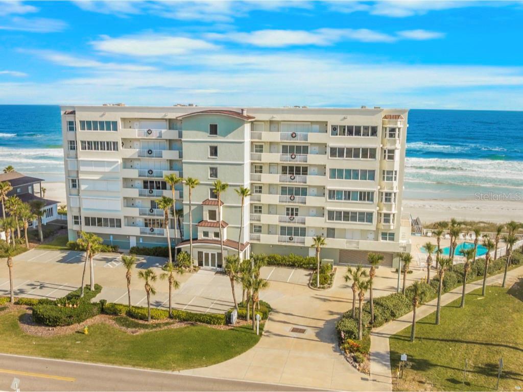 EXQUISITE DIRECT OCEANFRONT FURNISHED 3BR/3BA COASTAL RETREAT BOASTING SWEEPING OCEAN VIEWS & APPROXIMATELY 2,200 SQUARE FEET OF LUXURIOUS LIVING AREA PLUS A HUGE 40' PRIVATE OCEANFRONT BALCONY!! This spectacular condo is located in the exclusive Martinique Condominium on the pristine sugar sand ''no drive'' beach in the beautiful coastal enclave known as Ponce Inlet. Boasting just 24 elegant residences, resort-style amenities and a limited rental policy, this magnificent condo offers a level of privacy rarely found in oceanfront condos. This awesome showplace is freshly painted and has a spacious open split bedroom floor plan featuring 9' ceilings, two separate living areas for added comfort, two huge oceanfront primary en-suite bedrooms (one with a Murphy bed) each with sliders to the oceanfront balcony & private spa style bathrooms. The third bedroom is also spacious. Travertine flooring throughout makes this superb residence perfect for beachside living.  Enjoy vibrant sunrises from the oceanfront great room & the west facing family room is perfect to watch magnificent sunsets every day! The chef's fully-equipped eat-in kitchen has a convenient breakfast bar, Viking, Bosch & GE appliances, Granite countertops, full backsplash, ample cabinet space & custom pantry. Additional features include a new HVAC system in April 2021, electric storm shutters, a large inside utility/laundry/storage room with a sink, plus an additional outside private storage room for bicycles and beach toys. The sparkling heated pool & spa is located on the south side of the building for maximum sun all day. A fitness center and club room also add to the upscale amenities. The secured entrance, inviting lobby & underground parking provide security and peace-of-mind. See jaw dropping rocket launches from the expansive 40' private balcony! This meticulously maintained building has excellent management and NO pending assessments. Pet friendly with NO weight limit!  Walk or bike to the historic Ponce de Leon Lighthouse & Jetty Park, Marine Science Center, charter fishing, marinas, waterfront restaurants with entertainment, dog park/beach, sailing & more!! Enjoy Florida coastal living at its finest!!