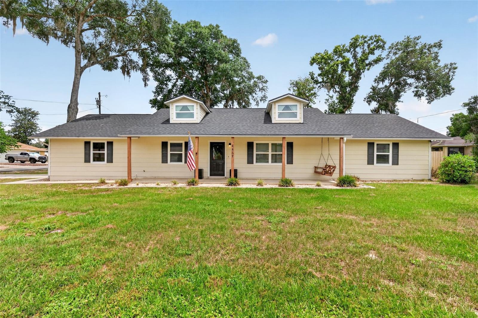 Filled with charm and sitting on over half an acre with beautiful oak trees and a fully fenced back yard, this house is ready for its new owners! The interior offers vaulted ceilings and an open floor plan. Both bathrooms have been updated/remodeled and brand new carpet was just installed in all three bedrooms. The backyard features a privacy fence with a separate, oversized dog run and a large screened in back porch to enjoy beautiful evenings outside. A new roof was installed in 2023, new windows and sliding glass door in 2021, new water heater & water softener in 2021 & a new HVAC system in 2026.