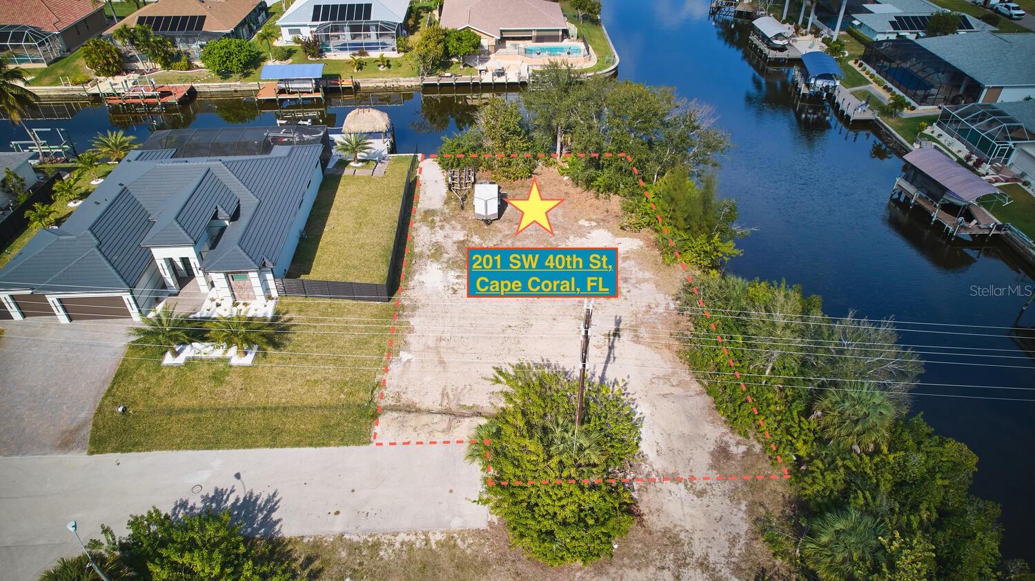 Bring your Building plans! AWESOME Oversized intersecting Canal lot! one side bordering Katama Canal and the other side bordering Lotus Canal. GULF ACCESS with two bridges, each bridge being 9 foot three inches in height. The lot is at the end of SW 40th Street with new houses being built on this street. Assessments have been paid. This location is close to schools, shopping, and a soccer complex. Build your Dream!
