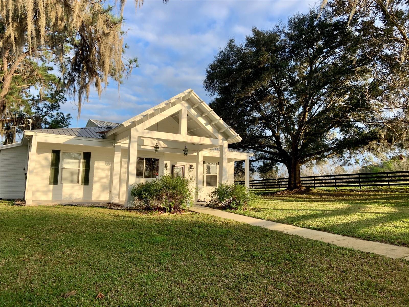 This Magnificent 79 acre working cattle ranch, known for it's pure water and fertile soil, is divided into 7 large parcels providing endless possibilities for the buyer. Avid equestrians will appreciate the facilities in place which include a brand new 20 stall horse barn, cattle pen, horse riding arena, equipment barn, hay barn, five naturally spring fed ponds, abundant wildlife and extensive wooded riding trails.
On this gorgeous property you will find two homes which have both been remodeled and upgraded. The main home features a soaring ceiling with wood beam accents, an open split floor plan and tile flooring throughout. Beautifully updated gourmet kitchen with pull-out shelving and 3 en suite bedrooms with private baths. Two of the bedrooms open onto the relaxing large screened lanai thru French doors.
In the Cottage/Studio which is adjacent to the main home you will find a two bedroom, two bath guest house which includes a full kitchen, spacious living area/event space, full bath and office on one side plus two bedrooms, full bath, kitchenette and additional living quarters on the other side. The cottage guest suite is brand new top to bottom. 3 triple sliders open to a large 40’ x 16’ composite deck from the studio/event area.
A 46'x25' building can house farm equipment or recreational vehicles. Four board fencing surrounds the property and sections off numerous pastures; most gates include remote access. Only the highest quality of Tifton 44 grass can be found in these pastures for both grazing and hay production. A 60' X 40' drive-thru hay barn capable of sustaining 140 mph winds is located by the horse arena. Trails for walking, riding and ATV's. 

This is a rare and unique opportunity to purchase an ideally located turnkey property which includes all the furnishings and equipment for running the ranch as well as an event venue, along with the owner’s current inventory of farming equipment, machinery and livestock.
Other notable features of this property include: newer HVAC system, new electrical box/service hub in main house & tractor barn, new well pump, wiring & piping, metal roof, alarm system and Alert360 exterior cameras on porches, cedar ceiling and walls in studio, seamless gutters with gutter guards, 50 amp RV line, new hot water heater in cottage, Zoned AG, this property can offer both investment and lifestyle returns. Some income producing opportunities include horse boarding, trail rides, riding lessons, training, cattle sales, turkey hunting, Air BnB, hay sales, U Pick berry farm, wedding venue, corporate retreats, family events such as birthday parties, bridal & baby showers & wellness center including Yoga, Pilates and other wellness classes.