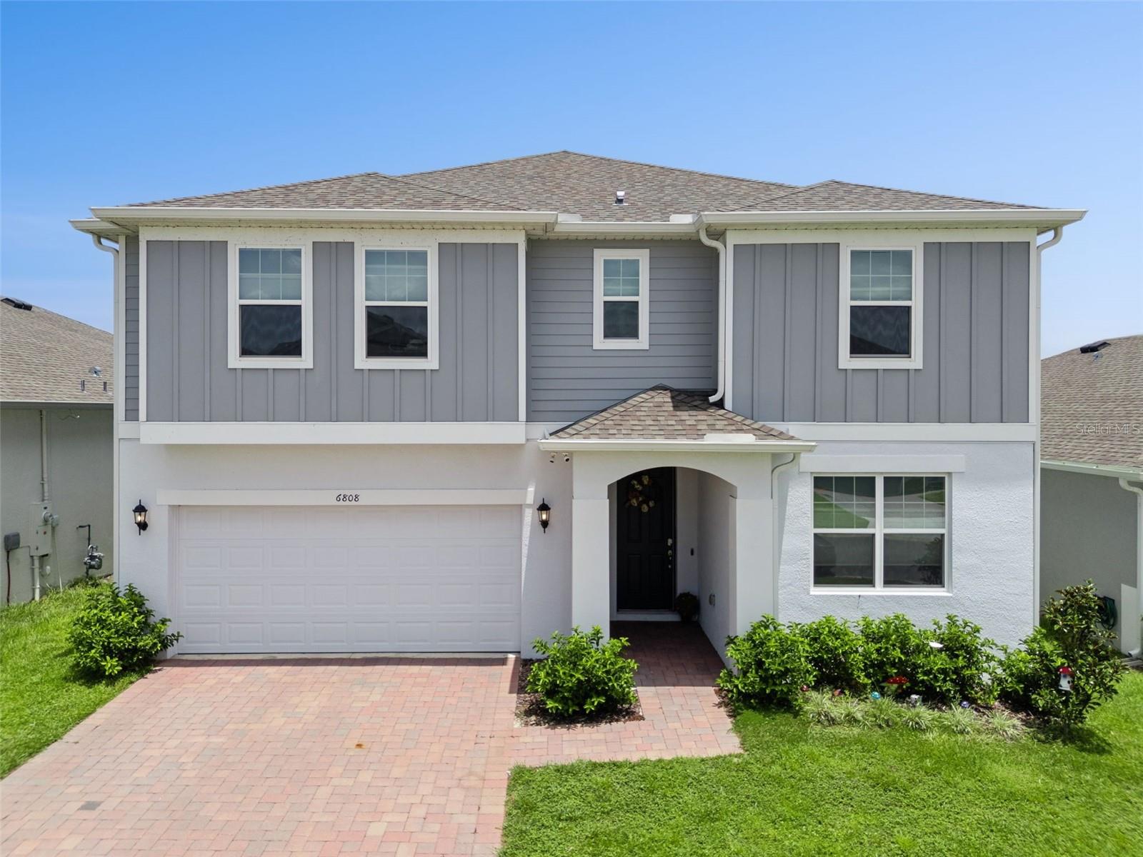 Welcome to this stunning 2024-built Sims 4 model, where luxury, comfort, and thoughtful design come together to create the perfect home for modern living. This is a rare opportunity in Central FL. Trinity Builders has only built a few of this model in the community. The current owners have made some attractive additions and have meticulously maintained this home. Offering 5 spacious bedrooms, 4 full bathrooms, a private den on the first floor that could serve as a 6th bedroom without a closet, versatile loft, and over 3,200 square feet of beautifully designed living space. This home is ideal for growing families, multigenerational living, or those who love to entertain.

The open-concept floor plan centers around a chef-inspired kitchen featuring a large island with seating, owner upgraded Samsung Smart appliances that are Google and Alexa compatible. You won't get those appliances from the builder. This was the first Sims model to be sold in the community. Though it wasn't a model home, there are more builder upgrades than are currently being included in their homes. There is abundant cabinetry, and seamless views of the expansive family and dining areas. Filled with natural light, this inviting space is perfect for everyday living, holiday gatherings, and entertaining guests. A first-floor guest suite with a full bath provides privacy and flexibility for visitors, in-laws. 

Upstairs, a generous loft offers endless possibilities as a media room, game room, playroom, or second living area. The luxurious owner's suite serves as a private retreat, complete with dual vanities, a spa-inspired oversized walk-in shower, a spacious walk-in closet, and an additional flex room that can be customized as a nursery, another home office, Gym room, or expanded closet. An upstairs laundry room adds everyday convenience.

Designed with today's lifestyle in mind, this home also features the innovative Trinity Package Place with secure coded exterior access for all your deliveries and a covered rear lanai overlooking a backyard ready for your personal vision. The Owners upgraded their home home with smart light switches, custom window treatments, gutters, and as mentioned Google and Alexa smart home compatible app. This is an upgrade package conservatively valued at over $12,000. 

Located in the desirable Eagletail Landing community, residents enjoy a resort-style community pool and covered playground, with convenient access to the Chain of Lakes, scenic walking trails, championship golf courses, and just a short drive to Mount Dora, Clermont, and Orlando. This exceptional home offers the perfect blend of luxury, flexibility, convenience and is ready to welcome you home. Come quickly!