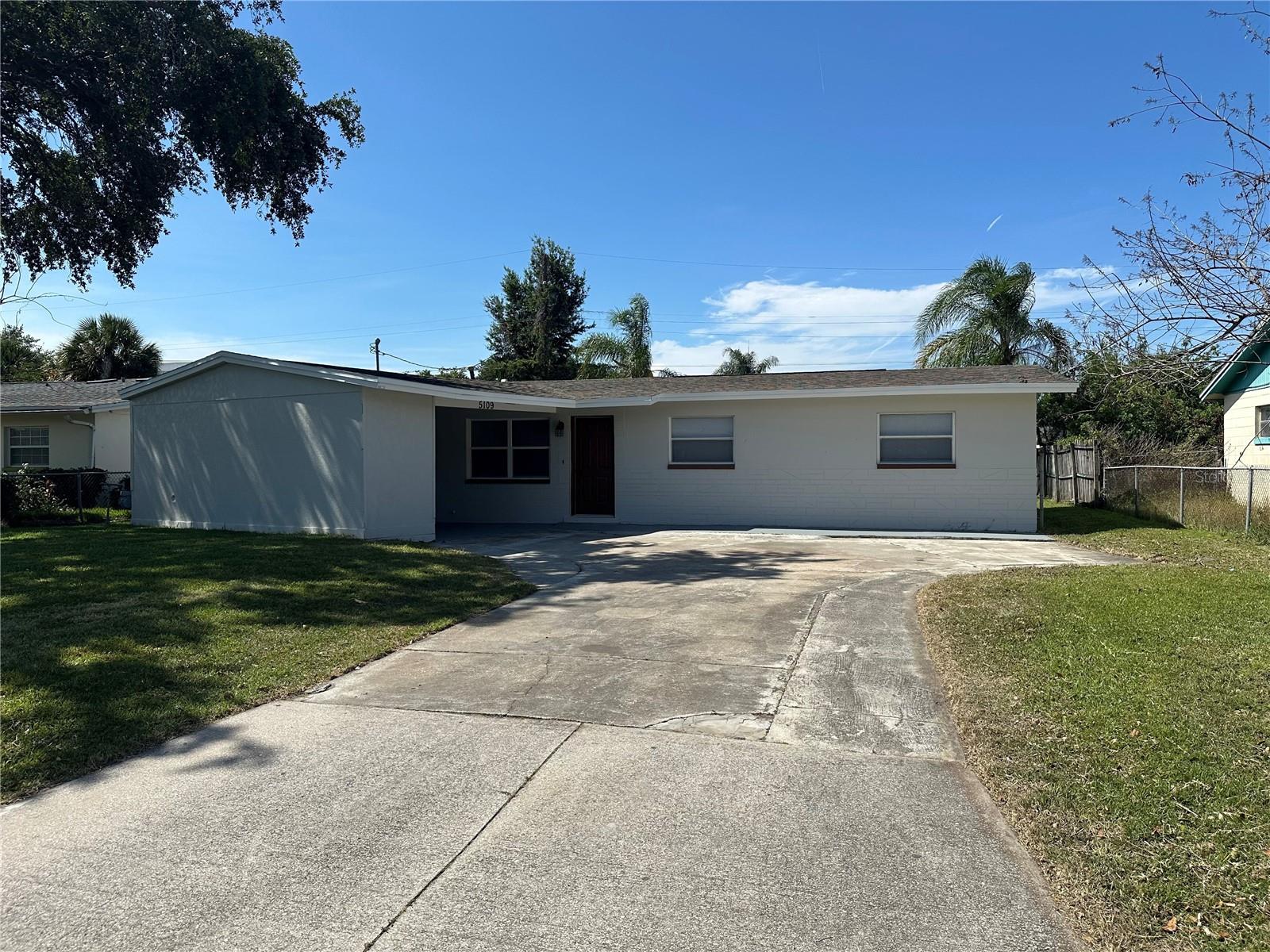 Come see this CUTE MID-CENTURY MODERN HOME WITH CARPORT CENTRALLY LOCATED IN THE SOUGHT AFTER ZIP CODE OF 32819! This home has FOUR BEDROOMS, BEAUTIFUL KITCHEN, NEW DUCT WORK and LARGE PRIVATE AND BEAUTIFUL YARD! The kitchen has been updated with NEW CABINETS, STONE COUNTERTOPS and STAINLESS STEEL APPLIANCES and GAS COOKING!. The home has NO CARPET and roof was replaced in 2019! This home sits on an OVERSIZED HOMESITE that is ALMOST FULLY FENCED in and is tucked into the community offering a QUIET, PEACEFUL SETTING and the BACKYARD OFFERS PRIVACY and PLENTY OF ROOM for a FIRE PIT, POOL or anything you would like to enjoy. The home has lots of windows offering tons of NATURAL LIGHTING. This home is in a CENTRALLY LOCATED AREA of Orlando with PUBLIX, PREMIUM OUTLET MALLS and other shopping just minutes away. It is located less than 3 miles to Universal Studios, less than 4 miles from the Mall at Millenia, just 10 miles to Orlando International Airport and 11 miles to Disney! You will be located just minutes from 408 and I-4  to get anywhere you want to go quickly. Come visit this CUTE, UPDATED home at an AMAZING PRICE!