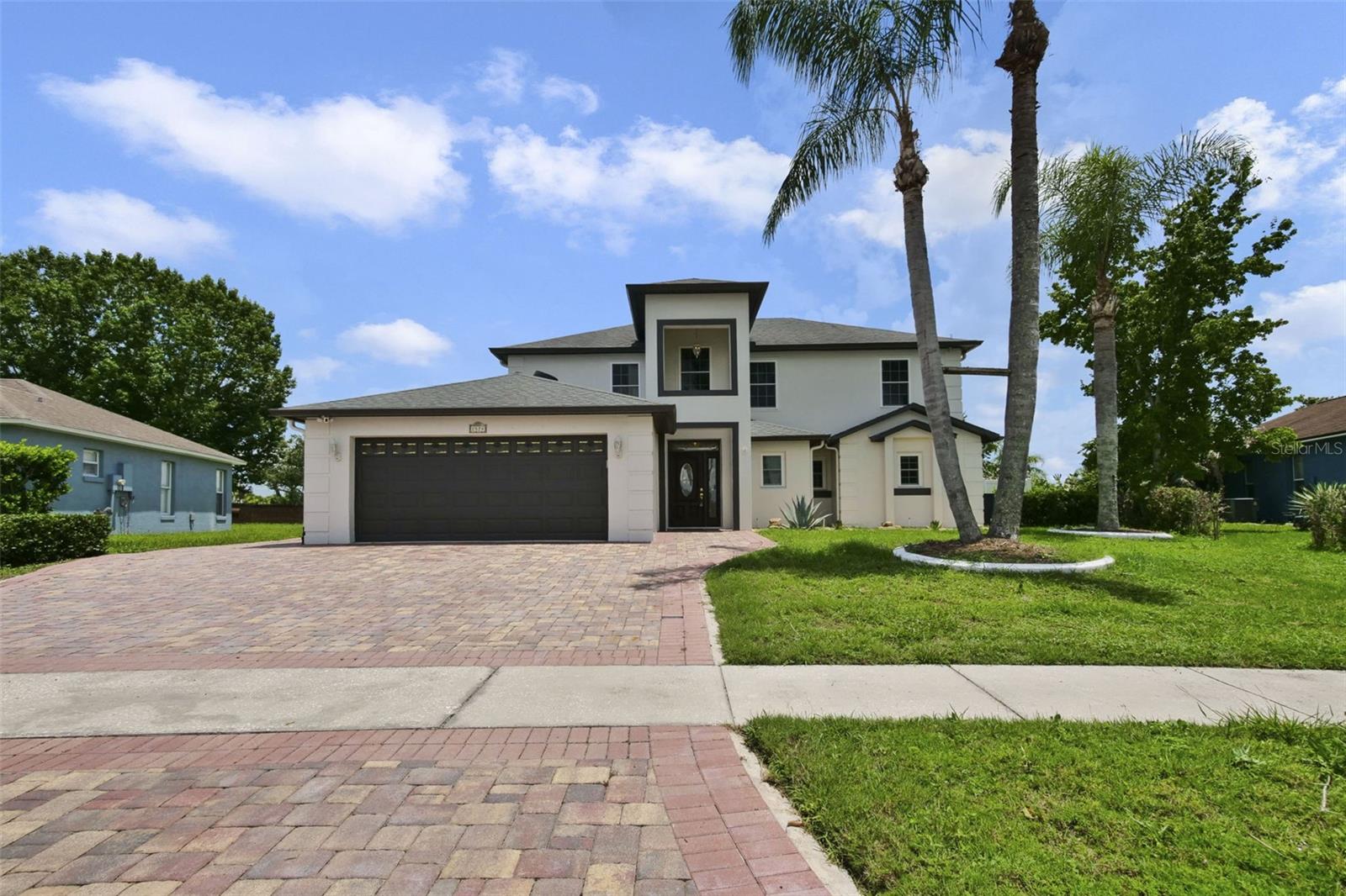 Welcome to this beautifully appointed, move-in-ready four-bedroom, two-and-a-half-bath residence nestled in a desirable Kissimmee neighborhood without the restrictions or fees of a homeowners association.
Designed with modern living in mind, this impeccably maintained home features fresh interior paint and new luxury vinyl plank flooring throughout, creating a clean, contemporary aesthetic that's ready for its next owner. The spacious and versatile Florida room provides the perfect setting for relaxing, entertaining, or enjoying year-round indoor-outdoor living. The thoughtfully designed floor plan offers comfortable living spaces for everyday life, while the three-car garage includes a dedicated outlet for electric vehicle charging, adding convenience for today?s lifestyle.  Step outside to a maintenance-free backyard finished with premium artificial turf, allowing you to enjoy lush green space without the upkeep. Conveniently located near shopping, dining, entertainment and major roadways, this home offers comfort, functionality and easy access to everything Central Florida has to offer.