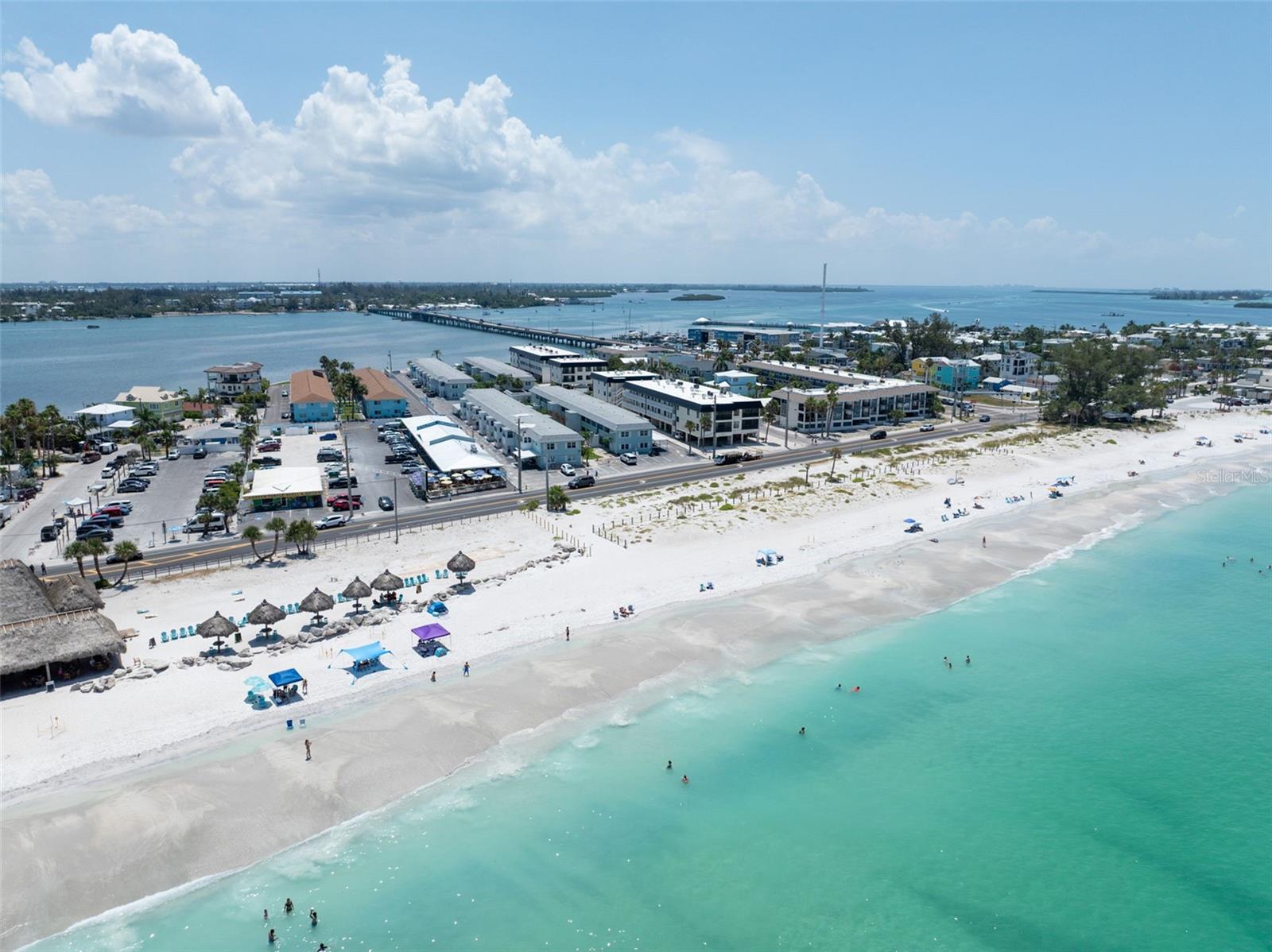 Awaken your senses to the rhythm of the tides in this rare, second-floor sanctuary nestled on the sun-drenched shores of Bradenton Beach.   Imagine starting your mornings with a gentle breeze drifting through your windows, offering a serene water view of the bay, while the world-class, powdery white sands of Anna Maria Island remain just a heartbeat away.  This charming retreat, featuring two bedrooms and one bath with elegant wood flooring, offers an unparalleled opportunity to embrace the quintessential coastal lifestyle at one of the most accessible price points on the island.  You won't find a better walkable location to everything including restaurants, nightlife and shopping.  while others are searching for expensive parking you get to be in the middle of it all in one of the most sought after communities where the owners are more seasonal and you won't have to deal with your weekly renters.  It so much more peaceful in a community with owners who are there taking care of their place and the community. 

Your days here are defined by leisure and connection to the water. When you wake up in the morning sit with your coffee in the lanai and watch the sunrise over the water.  Spend your afternoons casting a line from the private community dock or simply unwinding on the waterfront patio, where you can watch the graceful passage of boats against the horizon.  When you aren't exploring the island via the convenient free trolley, retreat to the brand-new community pool and clubhouse for a refreshing dip or a relaxing afternoon in the sun.  This is more than just a home; it is the realization of your lifelong dream to live where the land meets the sea.

Offered fully furnished you can just bring your suitcase and land yourself in the peace of your own property in one of the best locations on the most popular island of Anna Maria in gorgeous southwest Florida.  What are you waiting for?