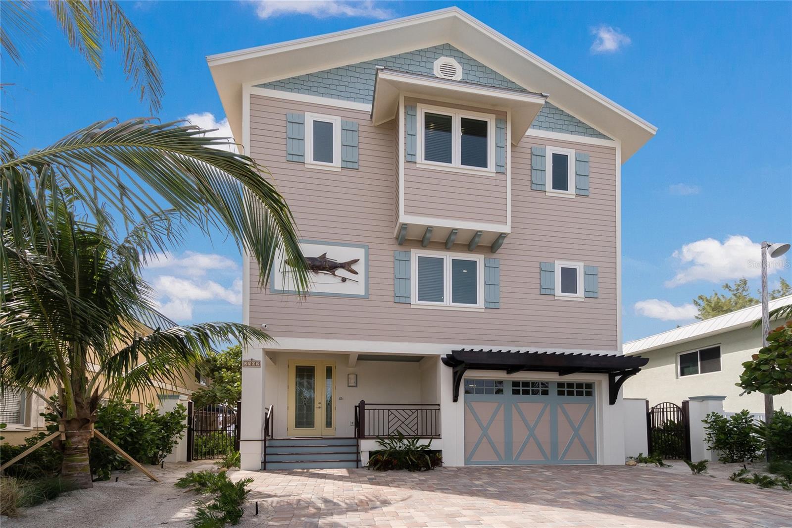 Experience the pinnacle of Gulf-front living on Anna Maria Island, one of the world’s top-rated beach destinations. This exceptional single-family residence is perfectly positioned directly on the pristine sands of the Gulf of Mexico, offering breathtaking sunset views and an unparalleled island lifestyle.
The home features a Gulf-side heated pool and spa just steps from the beach, creating a private coastal retreat ideal for relaxation and entertaining. With five en-suite bedrooms, this thoughtfully designed residence offers comfort, privacy, and spectacular water views throughout. Two beachfront terraces invite you to enjoy soothing Gulf breezes and unforgettable sunsets year-round.
Designed with both luxury and efficiency in mind, the property offers outstanding low-maintenance living and exceptional energy performance, including an 8,500-watt solar power system.
The top floor showcases an open-concept living and dining area, highlighted by French doors and a dramatic panoramic window that frames the expansive Gulf views. The gourmet kitchen is equipped with state-of-the-art appliances and a wine cooler, perfect for entertaining. Four en-suite bedrooms—two with direct Gulf views—are located on the first level, while the second level includes the main living spaces and the primary suite.
The views are truly breathtaking, extending north to the tip of Anna Maria Island. Whether as a private family retreat or a high-income investment opportunity, this remarkable Gulf-front home offers the best of coastal luxury living.