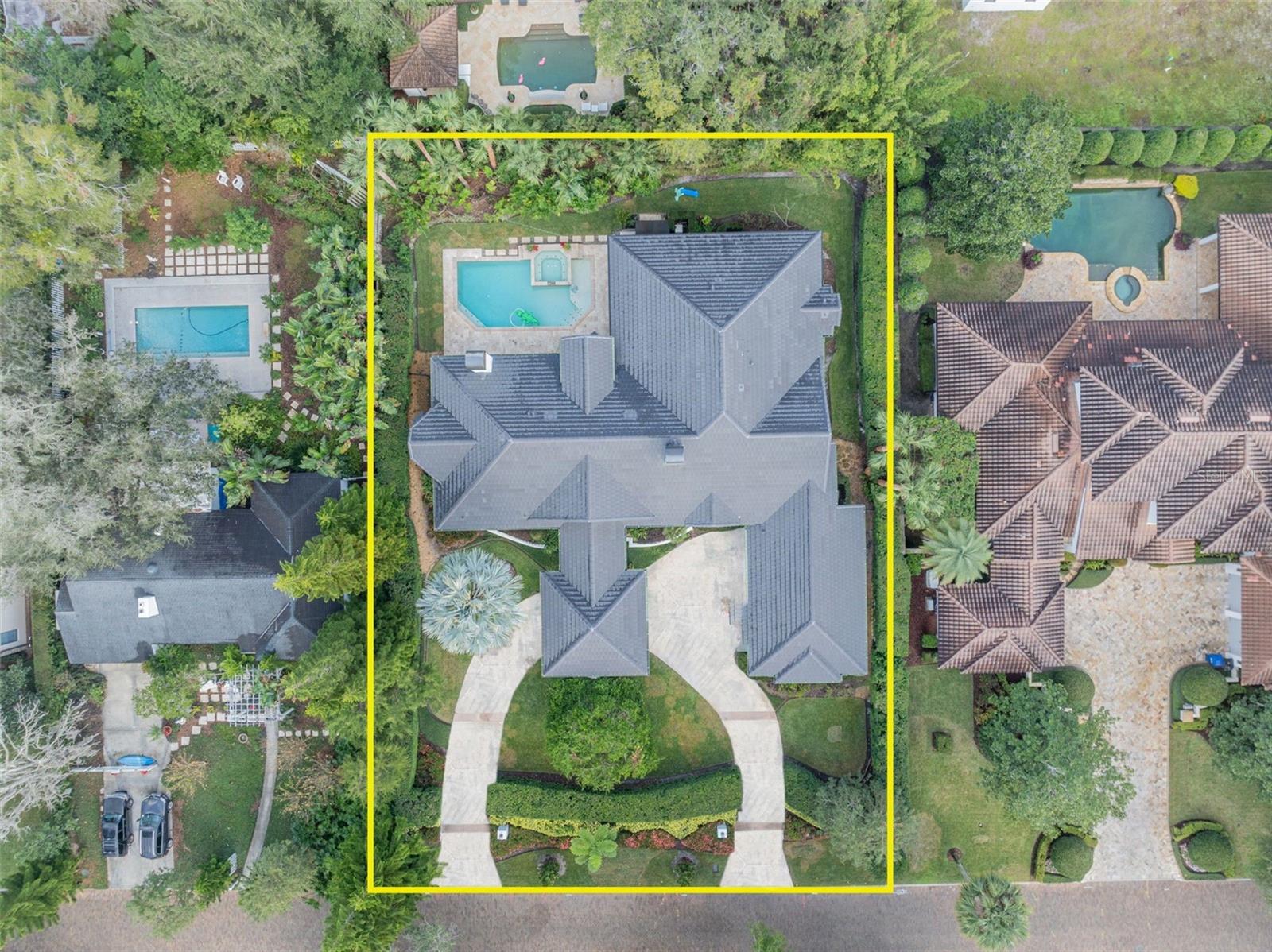 This stunning one-story home, situated on a nearly half acre lot in the heart of the Vias in Winter Park, offers a rare combination of luxury, comfort, and modern amenities. Boasting soaring ceilings between 12' and 17' and an expansive private pool area, this home is designed for both entertaining and everyday living. The home features solid maple cabinetry, maple hardwood floors, and custom built-ins throughout. Pella thermal pane windows provide excellent energy efficiency and natural light. Two remote-controlled gas fireplaces add warmth and elegance to the living/dining rooms and primary bedroom. Multi-slide glass pocket doors create a seamless flow between the interior and outdoor spaces, perfect for enjoying the resort-style pool area. A true culinary haven, the kitchen includes granite countertops, a 30” double Thermador convection oven, a 48” built-in Sub-Zero refrigerator, Bosch dishwasher, Viking wine refrigerator, and Dacor 6-burner gas cooktop—ideal for both intimate meals and large gatherings. The luxurious primary suite is a true retreat, with its own fireplace, his and her custom-designed walk-in closets, and an updated spa-like bathroom. The home offers an idyllic backyard with lush landscaping and a completely private pool and spa area. Retractable screens on the patio allow you to enjoy the outdoors in comfort, even on cooler days or without the presence of insects. Recent updates include a new tile roof in (2023), a renovated guest half bath (2023), and a renovated primary bath and closet (2024). The home has also been freshly painted inside (2022) and out (2024). A circular drive and 3-car garage provide ample parking and convenience, while the porte-cochère adds a touch of elegance to the entrance. The well-appointed laundry room includes a Leibherr 36” refrigerator, washer and dryer, sink, and pantry for extra storage. Set on a double lot (120 X 165), this home offers expansive outdoor space, providing privacy and room for relaxation or recreation. Nestled on a charming “Olde” Winter Park brick street, this home enjoys both tranquility and proximity to the best that Winter Park has to offer. This home is truly a rare find—combining luxury, comfort, and practicality in one exceptional package. It’s perfect for those who appreciate the single-story style, ample space, and the ability to entertain year-round!