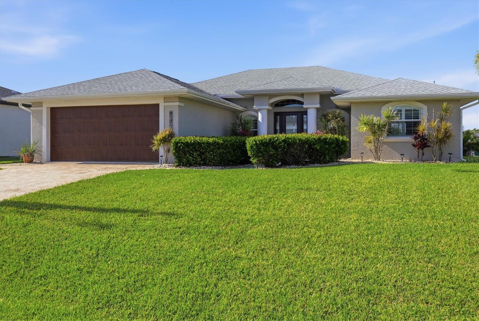 Location, lifestyle, and waterfront living come together beautifully in one of South Gulf Cove’s most sought-after waterfront communities. Perfectly positioned for the boating enthusiast, this gorgeous 3 bedroom, 2 bathroom home offers a short ride to open water with only one bridge along the way.

Inside, you’ll find a bright, inviting layout with plank tile flooring, granite countertops throughout, stainless steel appliances, a beautiful kitchen backsplash, insulated double-pane windows, and a clean coastal feel throughout. The home is beautifully maintained and move-in ready, giving you the chance to start enjoying the waterfront lifestyle right away.

The modern tiled bathrooms add to the home’s polished appeal, with the main bathroom featuring dual sinks and a walk-in tiled shower. A dedicated laundry room with a utility sink adds everyday convenience.

Step outside to the spacious south-facing lanai with panoramic screening, where you can relax, entertain, and take in peaceful water views all year long. Beyond the lanai, your outdoor paradise continues with a pavered patio, fire pit, and walkway leading to your private composite dock complete with water, electric, and lights.

While this home does not currently have a pool, that gives you the opportunity to create the custom pool and outdoor living space you’ve always wanted. Enjoy the home, dock, and waterfront setting now, then design your dream pool when the time is right.

Close to some of the best fishing in Southwest Florida, boating, golf, and just a short drive to the beautiful Gulf Coast beaches, this property offers an incredible opportunity to own affordable waterfront in a prime South Gulf Cove location. Don’t miss your chance to get on the water now and make this beautiful home your own.