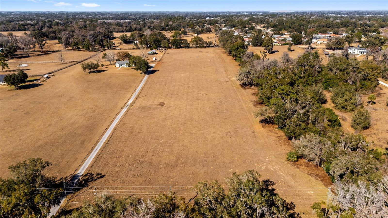 Rare opportunity to own 10 acres of beautiful residential acreage in Belleview, Florida, offering space, privacy, and endless potential. This expansive parcel provides the perfect setting for a custom estate, family compound, or homestead lifestyle.

With plenty of room for a main residence plus guest house, workshop, barns, or recreational amenities, this property is ideal for those who value elbow room and flexibility. Bring your horses, start a hobby farm, plant gardens, or simply enjoy the peace and privacy that large acreage provides.

Conveniently located within easy driving distance of shopping, dining, and medical services in Ocala, Florida, you can enjoy country living without sacrificing accessibility. Larger tracts like this are becoming increasingly hard to find in Marion County, Florida, making this a strong option for both end-users and long-term investors.

Build your dream home, create your private retreat, or hold as a land investment — this 10-acre parcel offers unlimited possibilities.