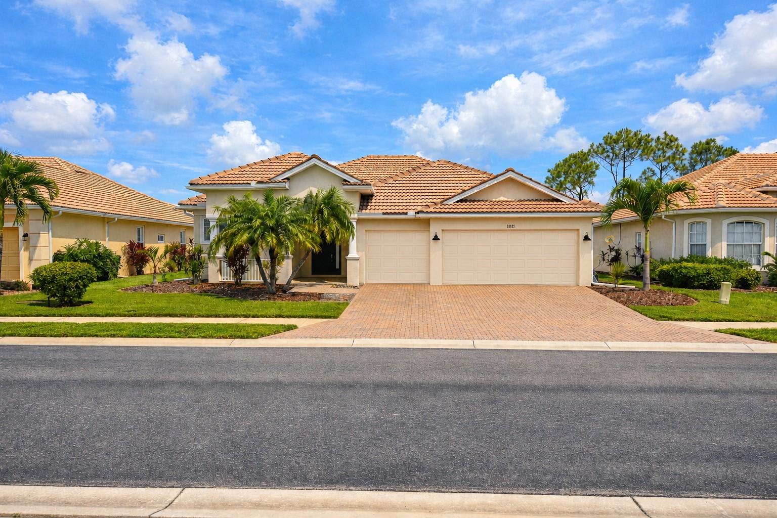 Warm and welcoming, this beautifully maintained 4-bedroom, 3-bath split-floorplan home offers peaceful POND VIEWS and is located in the highly desirable, master-planned community of Stoneybrook of Venice. Residents enjoy an incredible lineup of amenities, including brand-new pickleball courts, fitness center, community pool, full-time activities director, manned guard gate, basketball and tennis courts, volleyball, and much more, plus high-speed internet and DirecTV, all for a remarkably low HOA fee of $230/month.

This home has been thoughtfully updated with major improvements already completed for you, including a NEW TILE ROOF (2025) with double underlayment and extra fastening, A/C (2015), and a HOT WATER HEATER (2019). The garage ATTIC is fully DECKED WITH PLYWOOD across the ENTIRE space, offering exceptional storage with PULL-DOWN LADDER access. The lanai features NEW FRAMING and SCREENING.

Step inside and you’ll immediately notice the care and attention throughout. Neutral paint tones, separate living, dining, and family room spaces, and a tray ceiling in the family room create an inviting and functional layout. The kitchen features GRANITE countertops, an island with storage, and upgraded GE CAFE APPLIANCES, including a French-door refrigerator and double oven.

The entry opens to the dining and living rooms, with sliders leading to the screened patio overlooking the pond. To the left, the owner’s suite offers a tray ceiling, his-and-her closets, and an ensuite bathroom with DOUBLE VANITIES, a soaking TUB, and a separate shower. The owner’s suite also includes private access to the screened patio.

The kitchen’s eat-in area and the family room both offer additional sliders to the patio, creating great indoor-outdoor flow. The opposite side of the home features three additional bedrooms, including one with a Murphy bed and built-in storage, plus two full bathrooms — one with a tub/shower combo and one with a walk-in shower.

The home is also wired for a Jacuzzi spa, perfect for relaxing evenings overlooking the water. Conveniently located near I-75, restaurants, shopping, Gulf beaches, and the highly anticipated new $200 million Wellen Park high school, this home offers comfort, convenience, and resort-style living.