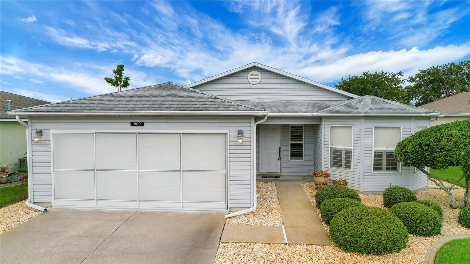 Welcome home to this charming 2-bedroom, 2-bathroom residence in the gated golf community of Pennbrooke Fairways. Step inside to soaring vaulted ceilings and beautiful French doors that open to a spacious tiled lanai, creating the perfect space to relax or entertain. The eat-in kitchen features tile flooring, a closet pantry, and a large pass-through opening to the living room, making it easy to stay connected with family and guests. Plantation shutters throughout the home add timeless style and privacy. The spacious primary suite offers a large walk-in closet and an updated ensuite bathroom complete with a dual-sink vanity and an updated walk-in shower with a built-in seat. Major updates include a 2019 roof and a 2022 HVAC, providing added peace of mind. Enjoy maintenance-free living with a low monthly HOA fee of just $265, which includes lawn care, high-speed internet, cable, and access to an outstanding selection of community amenities. Pennbrooke Fairways features 27 holes of golf, a pro shop, an on-site restaurant, two recreation centers, swimming pools, a fitness center, and countless activities including pickleball, tennis, shuffleboard, softball, horseshoes, water volleyball, and cornhole. Conveniently located near shopping and dining and just 6 miles from The Villages' Brownwood Paddock Square, this home offers the perfect combination of comfort, convenience, and an active Florida lifestyle.