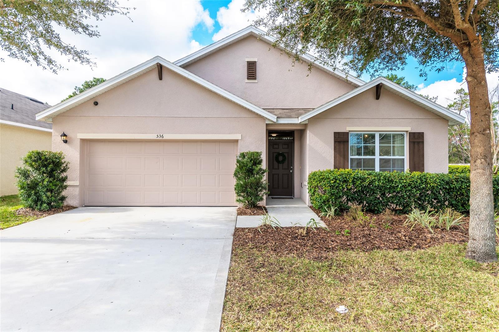 This gorgeous and immaculate 4 bedroom/2 bathroom home is like new, featuring many stylish and popular upgrades, a resort-like private paver patio, and the best location in Sabal Lakes - just steps to the community pool, extra guest parking and mailboxes.   **SEE ONLINE 3D VIRTUAL TOUR**  Decorated with colors, textures and finishes that look professionally chosen, this home is move-in ready, with beautifully upgraded lighting fixtures, flooring, interior paint and landscaping. A glass slider door has been installed in the master bedroom leading to the luxurious, large paver patio, shaded by a pergola in a backyard with privacy fence, hedges, and woods for your privacy.  This Parade of Homes award winning floorplan got it right  ... the master bathroom features dual sinks, a water closet, spacious linen closet and walk in closet, there is a walk-in pantry in the kitchen, a laundry room in the home, not the garage, and an open and inviting great room for entertaining.  The Sabal Lakes neighborhood is near the New Smyrna Beach Multi-use Trailhead, where you can bike to Hammond Park, Otter Lake, a disc golf course and continue east to Canal Street. The beach is only 6 miles away and there is a growing number of restaurants and shops nearby.  This is a spectacular home and showings are easy to schedule - don't miss it! ;Water: City