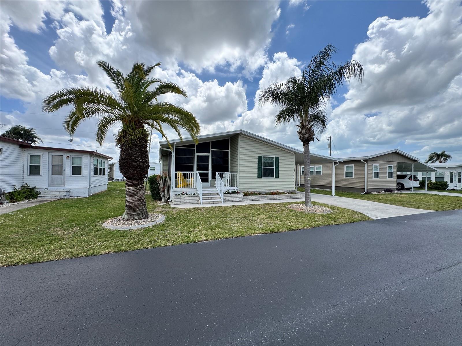 WELCOME TO WINDWARD ISLES – ONE OF SARASOTA’S MOST DESIRABLE RESIDENT-OWNED 55+ COMMUNITIES!

This WELL-MAINTAINED 2 BEDROOM, 2 BATH DOUBLE-WIDE HOME offers the perfect blend of comfort, convenience, and FLORIDA LIFESTYLE LIVING. Built in 2003 and featuring APPROXIMATELY 930 SQ FT OF HEATED SPACE, this home sits on a nicely sized lot with COVERED PARKING, A PRIVATE DRIVEWAY, AND ADDITIONAL STORAGE SHED.

Step inside to find a LIGHT AND BRIGHT FLOOR PLAN with LAMINATE FLOORING THROUGHOUT MAIN LIVING AREAS, a SPACIOUS LIVING ROOM, and a FUNCTIONAL KITCHEN equipped with CONVECTION OVEN, REFRIGERATOR, MICROWAVE, and more. The PRIMARY SUITE includes a WALK-IN CLOSET and EN-SUITE BATH, while the SPLIT BEDROOM DESIGN offers privacy for guests.

Enjoy your morning coffee or evening relaxation from MULTIPLE OUTDOOR SPACES INCLUDING A SCREENED PORCH, FRONT PORCH, AND REAR PATIO—perfect for taking in Sarasota’s year-round sunshine.

WINDWARD ISLES IS A LAND-OWNED CO-OP COMMUNITY offering residents access to a HEATED COMMUNITY POOL, RECREATIONAL FACILITIES, AND A FULL CALENDAR OF SOCIAL ACTIVITIES. The LOW HOA FEE (APPROX. $178/MONTH) INCLUDES WATER, TRASH, LAWN MAINTENANCE, AND COMMUNITY AMENITIES, making this an EXCEPTIONAL VALUE.

Ideally located just minutes from SHOPPING, DINING, MEDICAL FACILITIES, AND WORLD-FAMOUS GULF BEACHES, this property offers both PEACEFUL COMMUNITY LIVING and EASY ACCESS TO EVERYTHING SARASOTA HAS TO OFFER.

Whether you're looking for a SEASONAL RETREAT or a FULL-TIME RESIDENCE, this home is a fantastic opportunity to own in a HIGHLY SOUGHT-AFTER COMMUNITY.

SCHEDULE YOUR PRIVATE SHOWING TODAY.