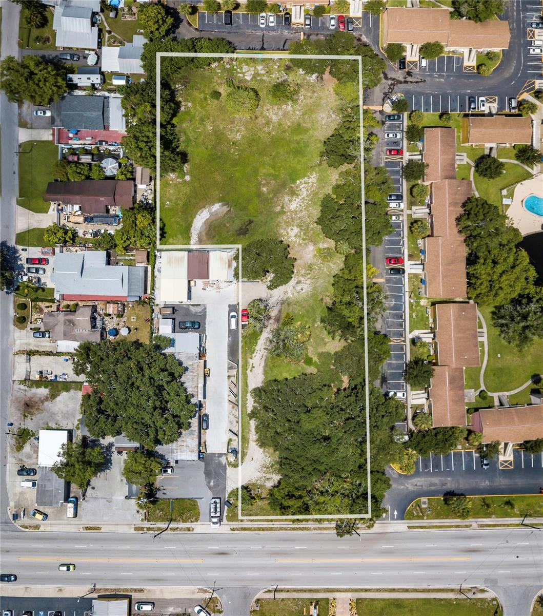 Rare ±1.54-acre infill development opportunity on high-traffic N Armenia Ave (±20,200 vehicles/day), minutes from Tampa International Airport, I-275, and downtown Tampa. Two folios being combined through annexation into the City of Tampa, bringing both parcels under a single PD (Planned Development) zoning with potential for increased residential density. The property carries an approved site plan for 10,200 SF of warehouse/flex (two 4,000 SF buildings + one 2,200 SF building), with potential to expand beyond 20,000 SF under the enhanced PD. Extensive due diligence already completed with the City of Tampa and Hillsborough County a turnkey, shovel-ready position for a developer or owner-user. Flexible upside: for-sale townhomes, multifamily, or warehouse/flex. Located among established residential and active commercial/industrial uses in one of Tampa's growing infill corridors. Seller financing available. Buyer to verify zoning, density, entitlements, utilities, and all measurements with the City and County.
