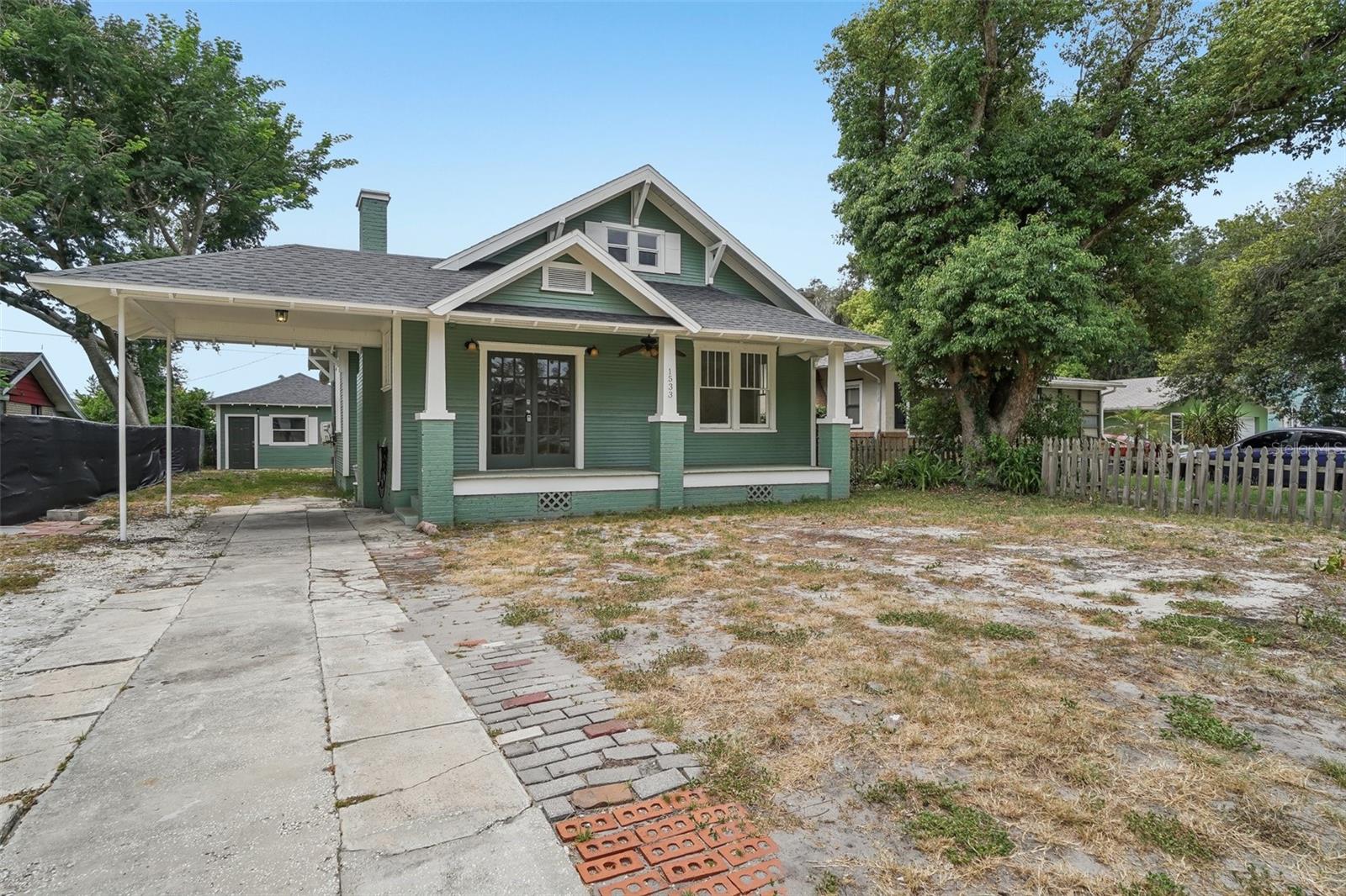 LOCATION! CHARACTER! SPACE! 
4/2+ Vintage Single Family with Guest House that’s within walking distance to Downtown Lakeland, a park with playground & both Lake Bonney and Lake Parker. The home offers space for a large family, multi-generational living, or rental income to subsidize your mortgage. The main home has a charming covered front porch, large windows, and hardwood floors in the living room, dining room and first floor bedrooms. The kitchen has an original built in for storage and has been partially updated including LVP flooring and updated appliances. The Primary En Suite is located to the rear of the home and features a primary bath with Freestanding Soaking Tub. Bathroom 2 is located off the living room in the hall between Bedrooms 2 and 3. Laundry hookups are located in the mudroom. The mudroom has the side entrance to the home and makes bringing in groceries easy as its next to the kitchen. There is a finished 2nd Floor, the perfect Flex Space for a large 4th bedroom, home office, media room, crafting space or home gym. The 2nd floor has had new LVP and windows installed along with new carpet on the stairs. Over the last 3 years the Sellers have been restoring this home but relocation provides a new owner with the opportunity to finish the interior to their own taste & style and to build equity. Recent improvements include new roofs on both buildings in 2024, Termite Tenting and a transferrable Termite Bond. Extensive repairs include: Exterior Wood Siding,  Floor Leveling,  Floor Joists, & Pillar supports. Repairs to the first floor hardwood floors. Professional Exterior and Interior Paint Replaced front porch decking. Window replacement in the primary bath.  The home has zoned heating and cooling with a combination of mini-splits and window ACs.  The chimney has been capped and the fireplace converted to electric use. The Guest House has a spacious functional layout with vaulted ceiling,  bathroom with with walk in shower, kitchenette with 220 hookup for range and and new siding and roof.  The home is currently livable but ready for your updates on your own schedule. Sold AS-IS. All dimensions are estimated and to be be verified by the Buyer. Sellers are requesting Cash & Conventional Financing offers only.