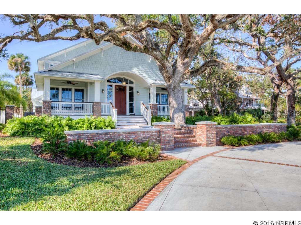 Situated on nearly an acre, this gracious waterfront  home is full of elegance and charm yet provides a comfortable Florida Lifestyle.  A TOTAL RENOVATION has been recently completed. Built with incredible attention to detail and superb craftsmanship, the main house has 5 bedrooms, 4 full baths and 2 half baths with  5000 square feet of living space. Truly unique details and finishes throughout including reclaimed heart pine flooring, Anderson vinyl clad impact windows and doors, timeless Carrara Marble Baths , Quartz  Kitchen Counters , Custom Lighting and Period Fixtures.   Generous Formal Living and Dining Rooms, Great Room & Media/Game Room. The gorgeous Chef's Kitchen has a 60" Wolf Natural Gas Range, Wolf Wall Vented Range Hood, Sub-Zero Pro 48 Refrigerator (the glass door model) , dual dishwashers , a wall of custom made glass fronted cabinets with a wet bar having its own ice maker and  temperature controlled wine storage. The first floor Master Suite has his & her water closets, honed marble vanities and a huge  walk in marble shower with dual rain heads, jetted body sprays.  Spectacular.   There is a separate, private  2nd level guest suite on the west end , while 3 additional large bedrooms & game/media room are situated upstairs on the east end of the home.  The 30' screened porch has fantastic views of the historic oak trees with Smyrna Creek in the background.  The dock and boathouse are also new with 2 boat slips, 2 boat lifts and a commercial floating dock making kayaking or paddle boarding easy at any tide. Next to the home lies a 1930's 1 bedroom cottage with over 800 square feet of living space , kitchenette, laundry room & east facing front porch.  The oversized 375 ft deep lot runs from Riverside Drive to Faulkner Street leaving ample room to build a Collector's Garage, Swimming Pool or even another Residence for a Family Compound.  Call for an easy showing, this home is amazing. ;Water: City