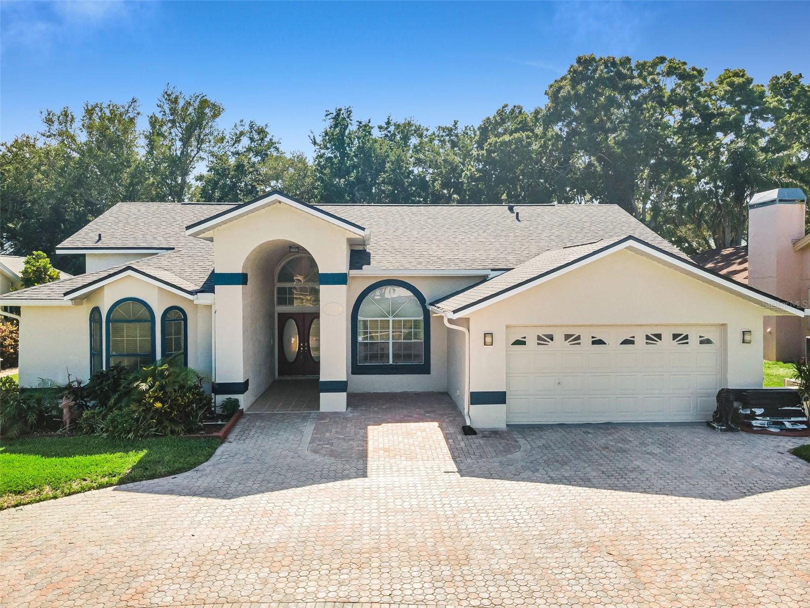 Virtually Staged. Welcome to one of Palm Harbor’s most desirable communities, Waterford Crossing! Ideally located just minutes from the Dunedin Causeway, Honeymoon Island State Park, and Caladesi Island State Park, this beautifully maintained home offers the perfect blend of comfort, space, and Florida living. 

Arrive to an oversized circular brick paver driveway and step through the double-door entry into formal living and dining spaces filled with natural light. This spacious split floor plan features 4 generously sized bedrooms, 3 full bathrooms, and a 2-car garage.

The primary suite is privately situated on one side of the home and features laminate flooring, high ceilings, abundant natural light, a cozy seating area overlooking the pool, and sliding glass door access to the screened lanai. The suite also offers two walk-in closets and an expansive en-suite bathroom complete with dual granite vanities, a glass-enclosed shower, and a separate tub.

On the opposite side of the home, you’ll find a beautifully updated kitchen with wood cabinetry, stylish hardware, granite countertops, ample storage space, a pass-through to the formal dining room, and a dinette area overlooking the family room. The family room features a fireplace and offers plenty of space for relaxing or entertaining.

Bedrooms two and three share a full bathroom and are conveniently located near the kitchen and family room. Toward the rear of the home, the fourth bedroom and third full bathroom provide an ideal setup for guests, an in-law suite, or pool access.

Step outside to enjoy the refreshing screened-in pool area, complete with built-in cabinets and a sink, perfect for entertaining year-round.

Additional highlights include:

- Roof replaced in May 2026
- HVAC approximately 3 years old
- Water heater replaced in 2025
- Propane option available

This exceptional home combines location, functionality, and outdoor living in one of Palm Harbor’s most sought-after neighborhoods, while also offering the convenience of shopping, dining, and everyday essentials just minutes away.