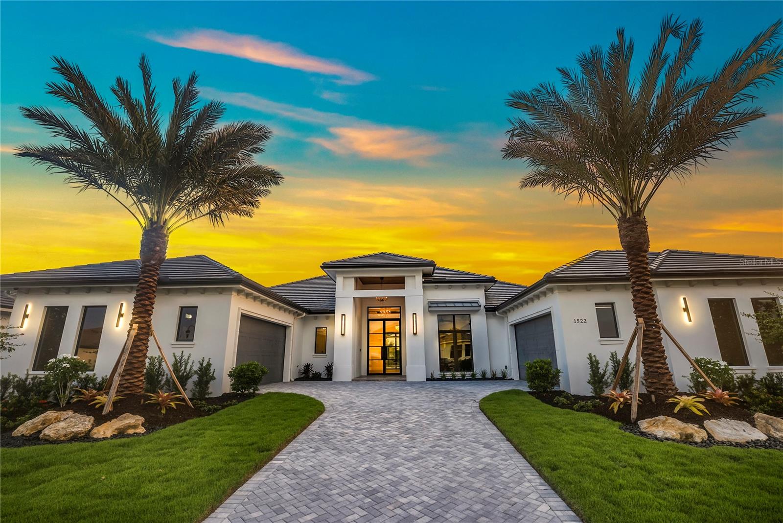 This exquisite home, featuring an open floorplan, is situated on a private lot with views of the Manatee River. Nestled within the 24/7 manned, gate-guarded community of The Islands at River Wilderness, this resort-style neighborhood offers effortless living surrounded by natural beauty and world-class amenities.
With 3,649 air-conditioned square feet, this 3-bedroom, 3.5-bathroom residence showcases stunning river views and a thoughtfully designed layout. The gourmet kitchen is equipped with top-of-the-line appliances and highlighted by a striking Cambria quartz island with waterfall edges that flow seamlessly to the wood flooring. The expansive great room includes a beautifully tiled entertainment wall and a built-in electric fireplace, creating a warm and inviting atmosphere.
Designed for both comfort and entertaining, the home’s open layout extends to generous outdoor living spaces. The luxurious primary suite features a spa-like bathroom with a soaking tub, dual-entry shower, and elegant tile accents.
This home features a top of the line Control4 home automation system with integrated security, lighting, audio, and window treatments.