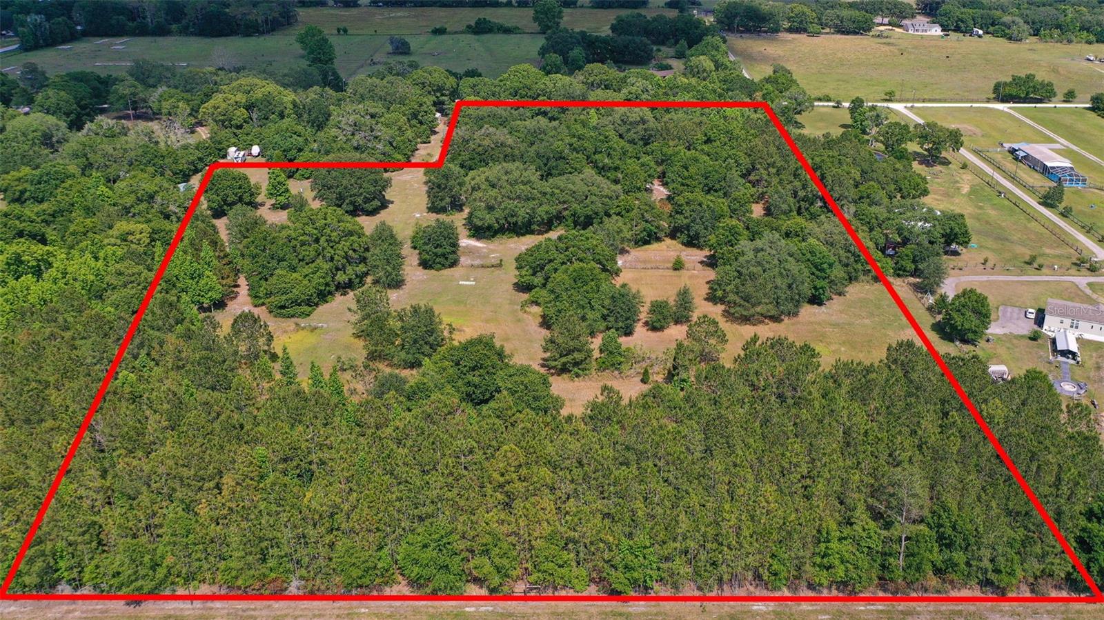 OWNER FINANCING AVAILABLE WITH 40% DOWN!!! INCREDIBLE OPPORTUNITY!!! BEAUTIFUL 14.41 ACRES OF BUILDABLE LAND in the heart of Dade City! Zoned AR/Agriculture SFR/MH & ZONED FOR 1 ACRE PARCELS. GREAT SITE FOR CUSTOM HOME-BUILDER HOME-SITES OR DEVELOPMENT, HIGH AND DRY! Looking for land for sale in Pasco County FL near Wesley Chapel and Mirada with development potential and infrastructure already started? This 14.41-acre property in Dade City offers a rare combination of AR zoning, dual addresses, and the potential to subdivide into 1-acre homesites (buyer to verify with Pasco County). This is not untouched raw land, the property includes existing electric service, plus a well and septic already installed (currently not active), giving you a valuable head start compared to other vacant land listings. The property offers a strong mix of open pasture and mature trees, ideal for: Custom home, build a Family compound, small development opportunity, Buy and hold investment/land bank. While the well and septic are not currently active, their presence can reduce future development time and cost compared to starting from raw land. This area is seeing rapid residential and commercial growth, making this property a high-upside investment in one of Pasco County’s most active expansion zones. Are you ready to have your imagination run wild with the endless possibilities? Bring your RV, Manufacture/Mobile home, building plans, investment, sub-divide or somewhere to make your own personal peaceful sanctuary! The property is fenced, very private and located near I-75. Coming soon, Century Link is installing fiber-optic lines on the street. No HOA or CDD! Plenty of room to store your boat, RV, trucks, trailers, 4-Wheeler, etc. Also, you can have your own garden to grow fruit and vegetables, have a plant nursery, animals, horses! Enjoy the peace & tranquility of your backyard with beautiful views! Minutes from Mirada Lagoon and the fast-growing San Antonio/Wesley Chapel corridor. Close to all, I-75, SR 52, Approx 40 minutes to Tampa, Shopping, The Premium Outlets, Dining, Entertainment, Golf Courses, Schools. Dade City has become one of the most attractive locations in the area. Don't miss this great opportunity! **** BY APPOINTMENT ONLY, PLEASE NO TRESPASSING ****