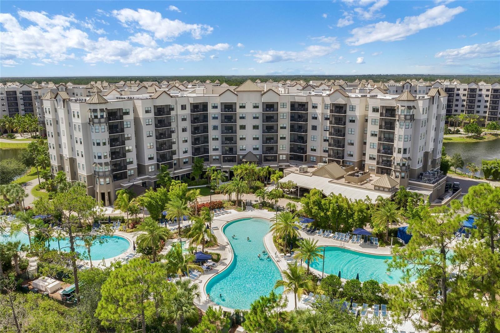 Experience the ultimate Orlando resort lifestyle and investment opportunity at The Grove Resort & Water Park, one of Central Florida’s premier vacation destinations located just minutes from Disney World and close to Universal Studios, SeaWorld, Margaritaville Resort, shopping, dining, and Orlando International Airport. This fully furnished, turnkey condominium offers a spacious open-concept layout with a beautifully designed kitchen, bright great room, oversized windows, and a private balcony with peaceful courtyard view—perfect for enjoying Florida’s sunshine and serene surroundings.  Designed for both comfort and flexibility, this condo features 2 bedrooms with a split layout for added privacy, spacious living areas, and 2 spa-inspired bathrooms with features such as garden tubs, tiled showers, and dual vanities. Large-screen televisions, modern finishes, and stylish furnishings create a welcoming retreat for owners and guests alike. This is a comfortable place to unwind after a day of fun.  The Grove Resort is a world-class, family-friendly destination offering exceptional amenities and a true “escape within an escape.” The highlight is the spectacular Surfari Water Park, featuring a FlowRider® surf simulator, dueling water slides, lazy river, splash park, activity pool, zero-entry pool, and private cabanas with food and beverage service. Guests also enjoy access to multiple resort pools, hot tubs, and a 20-acre activity lake with a private dock ideal for fishing or relaxing by the water.
Additional amenities include Longboard Bar & Grill, Valencia Restaurant, Element Bar & Lounge, Alfresco Market, Byte grab-and-go market, Flip Flop’s Family Fun Center, arcade, game room, and on-site dining and entertainment. Relax and recharge at the full-service spa and modern fitness center, or enjoy the convenience of daily shuttle transportation to Disney World, Universal Studios, and SeaWorld.
Ownership is truly hassle-free, with professional on-site hotel management handling bookings, guest services, and maintenance, making this an ideal hands-off income-producing investment property or personal vacation retreat. With its unbeatable location, incredible amenities, and strong rental potential, The Grove Resort offers the perfect combination of luxury, lifestyle, and investment value in the heart of Orlando’s world-famous attractions.