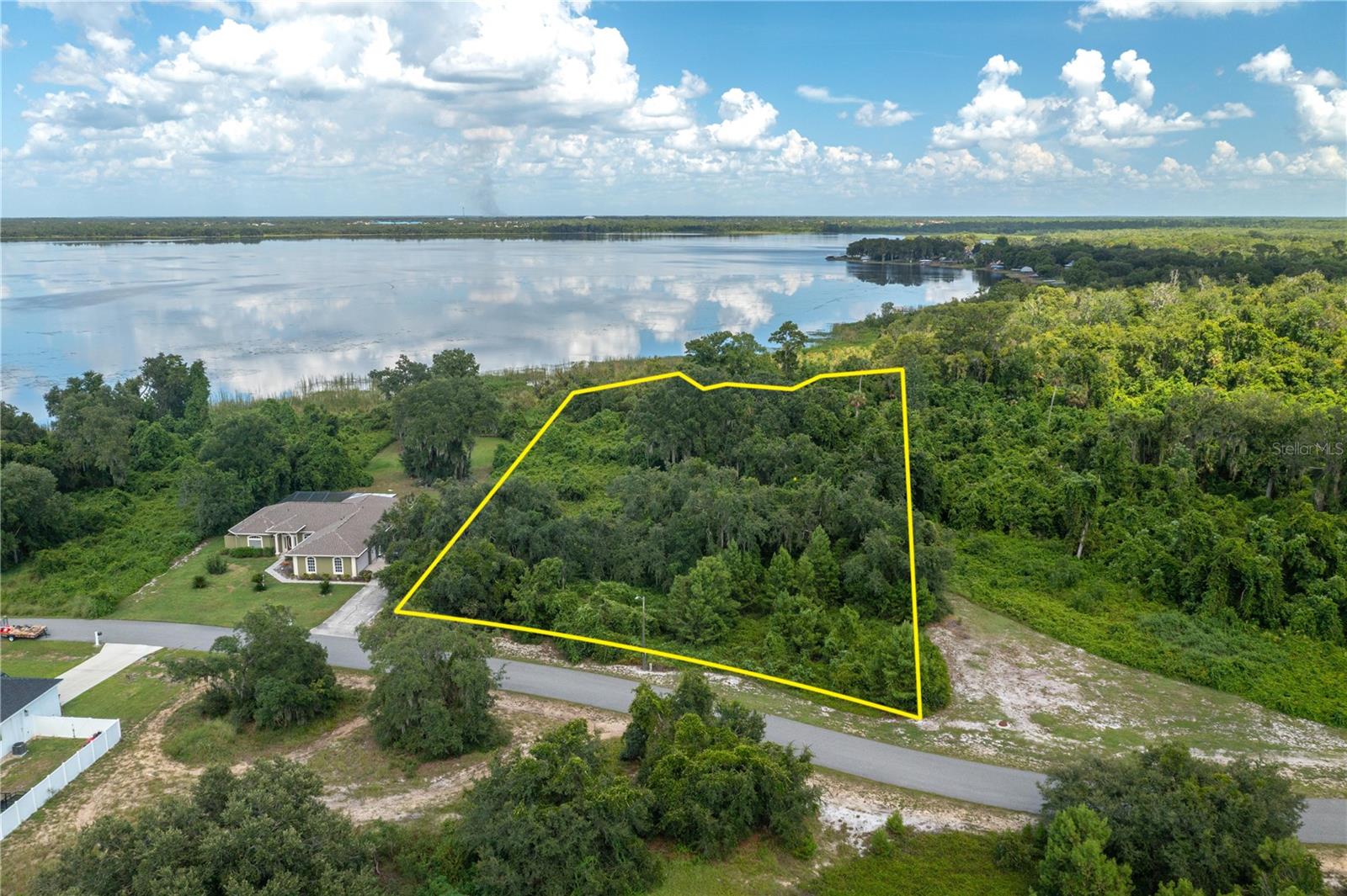 PRICE IMPROVEMENT – NOW DOWN $13,000! Rare Double Lot on Lake Marion | Nearly 2 Acres of Prime Lakefront Property. 
An incredible opportunity awaits on the shores of beautiful, spring-fed Lake Marion. This exceptional double lot totaling nearly two acres offers a rare chance to build your dream waterfront home in a peaceful, established neighborhood while enjoying expansive lake views and the natural beauty of one of Polk County’s most scenic settings. 
With generous space to design the custom home you’ve imagined, there’s plenty of room for outdoor living areas, lush landscaping, gardens, and recreational amenities—all set against the tranquil backdrop of lakefront living. 
Lake Marion spans more than 5,600 acres with over 20 miles of shoreline, creating the perfect setting for boating, kayaking, fishing, and year-round waterfront enjoyment. Known for outstanding bass fishing and serene natural beauty, this location offers both relaxation and recreation right outside your door. 
Nature enthusiasts will love the nearby Lake Marion Creek Wildlife Management Area, featuring more than 8,000 acres of preserved land with hiking trails, fishing access, and abundant Florida wildlife including white-tailed deer, wading birds, Florida scrub-jays, gopher tortoises, and more. 
Property Highlights: • Nearly 2-acre combined double lot • Prime lakefront setting with beautiful water views • Spacious homesite with endless design possibilities • Quiet, established subdivision • Conveniently located near Grenelefe, Haines City, shopping, dining, and local amenities • Ideal for a private retreat, custom estate, or active waterfront lifestyle • Measurements are approximate; buyer to verify. 
Whether you’re dreaming of a peaceful lakeside retreat, a custom waterfront estate, or a property that offers room to relax and enjoy the outdoors, this Lake Marion double lot delivers exceptional space, stunning scenery, and endless potential. 
Don’t miss this reduced lakefront opportunity. (Lots also sold separately at $139,900/lot.)
