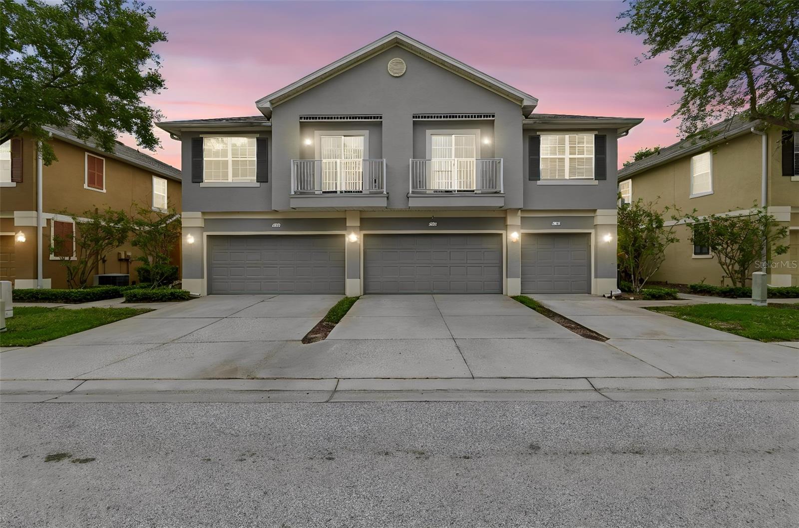 Discover maintenance-free living in the highly desirable gated community of Eagle Palms! This beautifully maintained 2-bedroom, 2-bath townhome offers a unique and spacious layout filled with natural light and designed for comfortable everyday living. The open-concept living and dining areas feature soaring ceilings, large windows, and dual private balconies that create a bright and inviting atmosphere. The kitchen is equipped with wood cabinetry, granite countertops, decorative backsplash, a breakfast bar, and a pantry for ample storage. The spacious primary suite includes a walk-in closet and an en-suite bath with dual vanities and a tub/shower combination. Recent upgrades include luxury vinyl plank flooring throughout the home and staircase. The ground-level one-car garage, indoor laundry room, and abundant storage add to the home's convenience. Residents enjoy a resort-style community with a sparkling pool, scenic ponds, mature landscaping, well-lit sidewalks, and 24/7 monitored gated access for added peace of mind. The HOA replaced the roof in 2017, and the community offers low HOA fees, strong reserves, and NO CDD fees. Ideally located with quick access to I-75 and US-301, you're just minutes from Downtown Tampa, MacDill Air Force Base, Tampa International Airport, shopping, dining, entertainment, and Florida's award-winning Gulf Coast beaches. A rare opportunity to own a move-in-ready home in one of the area's most convenient and well-maintained communities.