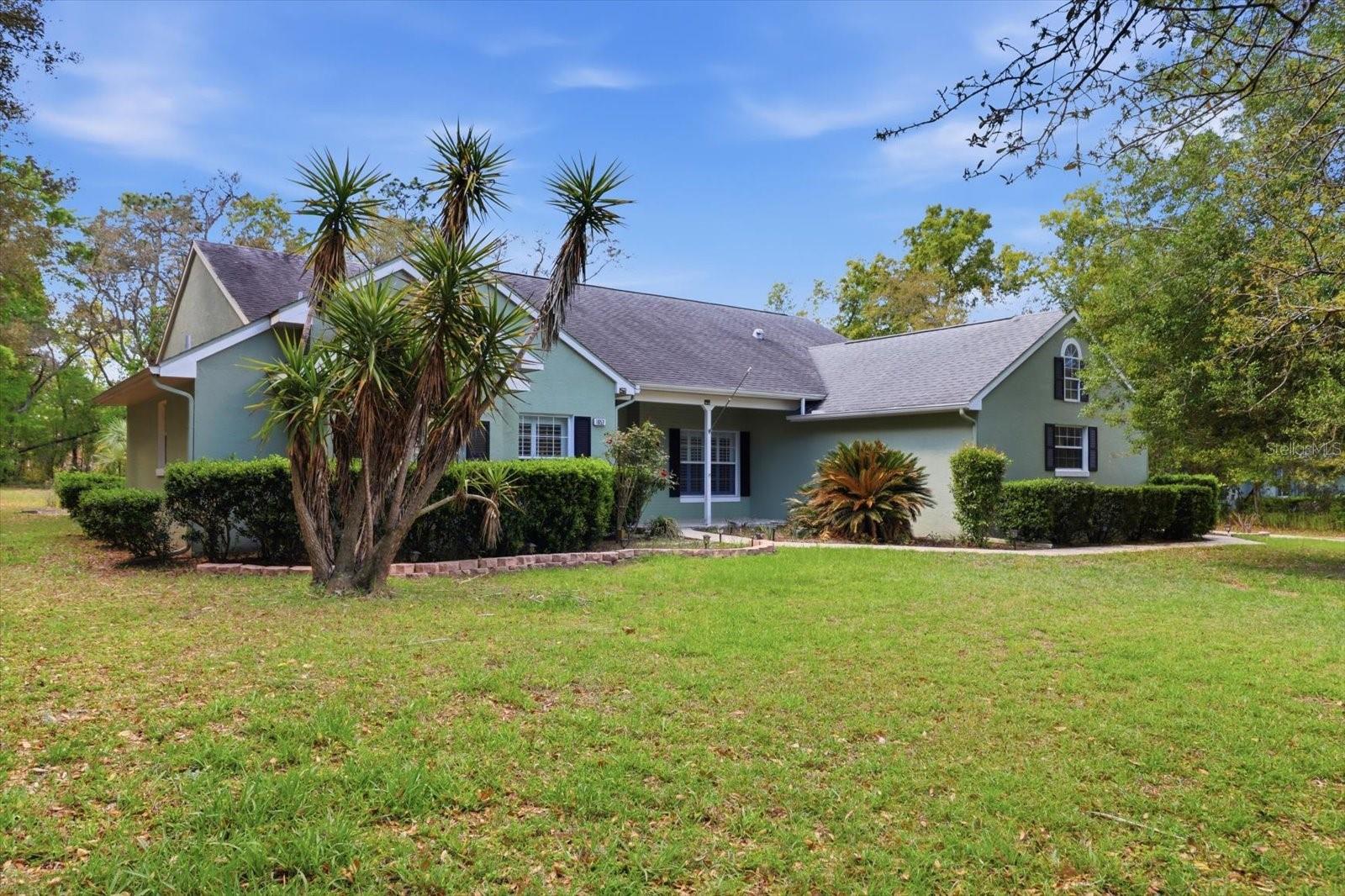 Move In Ready! See this amazingly remodeled, well maintained and nicely decorated 4/2/2 pool home on over 1 ac in Pine Ridge Estates. With an open floor plan, newer appliances, beautifully updated kitchen and lovely pool area, you can enjoy the Florida lifestyle. Beautiful landscaping surrounds the home and provides shade and privacy. The location is convenient to shopping and medical offices and is 30 minutes from Ocala. Pine Ridge is an equestrian community with a 20 stall community barn, riding trails, dog parks, pickleball and tennis courts and a community center.