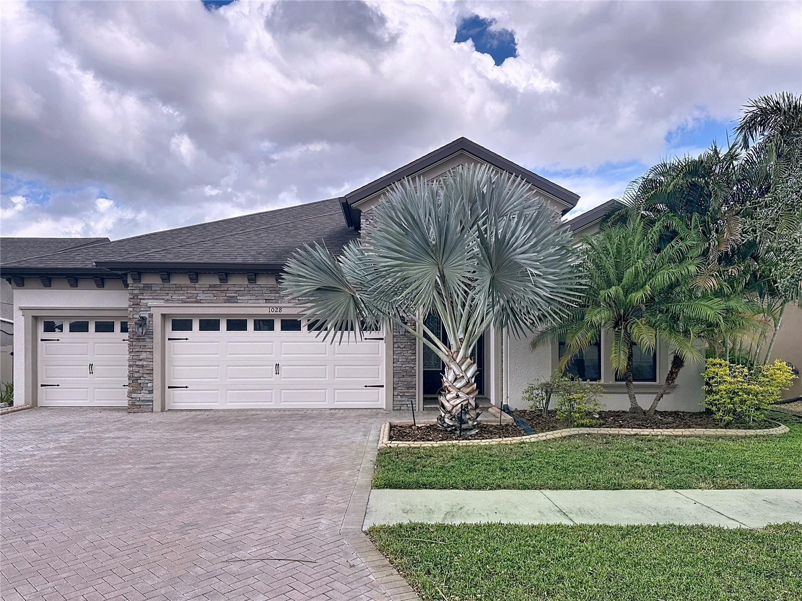 A Mediterranean, award-winning WestBay-built home that combines energy efficiency, luxury finishes, and exceptional outdoor living in one of Brandon’s most desirable gated communities — La Collina! This true 4-bedroom, 3-bathroom home with a spacious 3-car garage showcases top-of-the-line upgrades throughout. Elegant tray ceilings, quartz countertops, and stainless steel appliances make this residence truly one of a kind. The 8-foot interior doors and 12-foot ceilings create a sense of grandeur, while the open-concept floor plan seamlessly connects the chef’s kitchen, grand room, and outdoor living area. The kitchen features 42" cabinets, an oversized island, and a view overlooking the living and dining spaces — perfect for family gatherings and entertaining. Step outside to your private screened-in saltwater pool with an oversized patio and built-in stainless steel outdoor kitchen under a covered lanai — the ultimate Florida lifestyle experience. Additional upgrades include: Designer ceiling fans throughout Custom cabinetry in the laundry room Upgraded glass shower doors in all bathrooms Whole-house water purification system for clean, filtered water throughout Pre-wired surround sound system Overhead storage racks in the garage Seamless rain gutters with drain spouts Meticulously maintained and move-in ready, this luxurious home is perfect for those who love to entertain, relax, and enjoy the very best of Florida living.