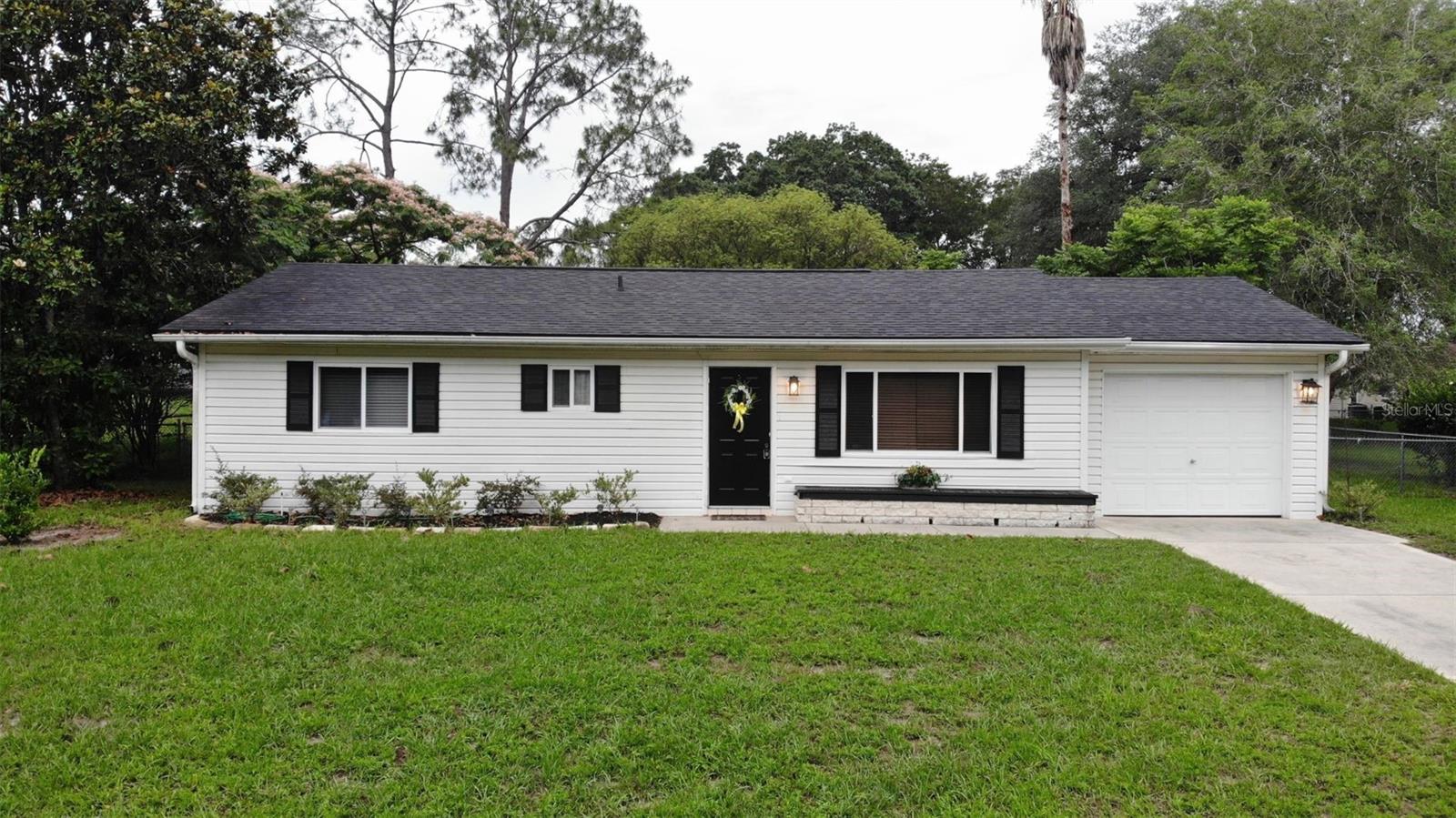 Experience the ultimate 55+ active adult lifestyle in Spruce Creek North! This well-built 2-bedroom, 2-bathroom home offers a phenomenal opportunity to step into a sought-after Ocala neighborhood and customize a space precisely to your taste. Featuring a highly desirable, easy-care layout, the property stands as a solid and well-maintained blank canvas, perfectly suited for anyone looking to add personal cosmetic updates and modern touches over time to match their unique style. The home features an incredibly functional floor plan designed for effortless living. Imagine waking up in your primary suite, prepping breakfast in a bright kitchen, and sliding open the doors to a rare, fully fenced backyard. This outdoor space is a true premium feature for the community, providing a completely private retreat for peaceful morning coffee, outdoor gardening, or letting pets play safely. Indoors, the high traffic area of this home is completely carpet-free, utilizing durable tile and luxury vinyl plank floors offering an excellent foundation for whatever design direction you choose to take. Resort-Style Amenities & Active Community Living Beyond your front door, a modest $121 monthly HOA fee handles trash removal and common grounds maintenance, giving you total freedom to immerse yourself in a vibrant, resort-style community lifestyle. Spruce Creek North offers top-tier amenities right at your fingertips: Sparkling Community Pool: Perfect for daily exercise, cooling off on warm Florida days, or lounging in the sun. Active Social Clubs: Join friendly matches and tournaments with established clubs for Bocce, Shuffleboard, and Horseshoes. Lively Clubhouse: The social hub of the community, hosting regular events, activities, and seasonal gatherings. You can move forward with your personalization plans with complete peace of mind, knowing that a foundational capital improvement has already been completed—the home features a brand-new 2025 roof protecting your investment for decades to come. Prime Location, Dining, & Convenience Location is everything, and this property puts you exactly where you want to be for a fun, active retirement. You are situated just minutes from Ocala’s premier State Road 200 corridor, which is packed with exceptional shopping centers, diverse dining choices, local golf courses, grocery stores, and daily conveniences. For added peace of mind, this prime location also offers seamless, everyday convenience for veterans and peace-of-mind healthcare: Ocala VA Clinic: Located just moments away off State Road 200 on SW 49th Road, this massive, modern facility makes managing veteran benefits and primary care effortless. Premier Medical Care: Enjoy swift, direct access to West Marion Community Hospital and top-tier specialists lining the SR-200 corridor, keeping your health close and your lifestyle worry-free. Whether you are looking for a structurally sound, rightsized personal sanctuary to personalize into your dream retirement home or looking for a high-demand rental asset near major civic and lifestyle hubs, this property delivers incredible intrinsic value. Bring your design vision and enjoy the best of Ocala's most welcoming age-restricted communities. Schedule your private tour today to explore the endless possibilities!