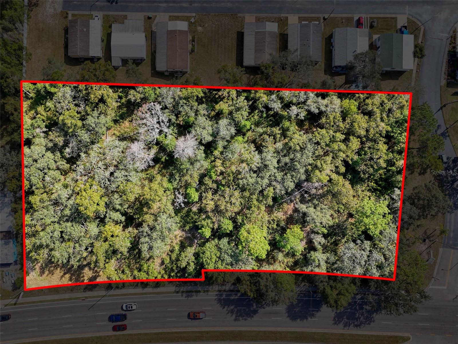 Large Commercial parcel with +-445 front feet on State Rd 52.  C-2 Zoning means many potential uses for your next project.  Over 2.3 acres located in Prime Growth Corridor of West Pasco County, short drive to Suncoast Parkway or US Hwy 19.