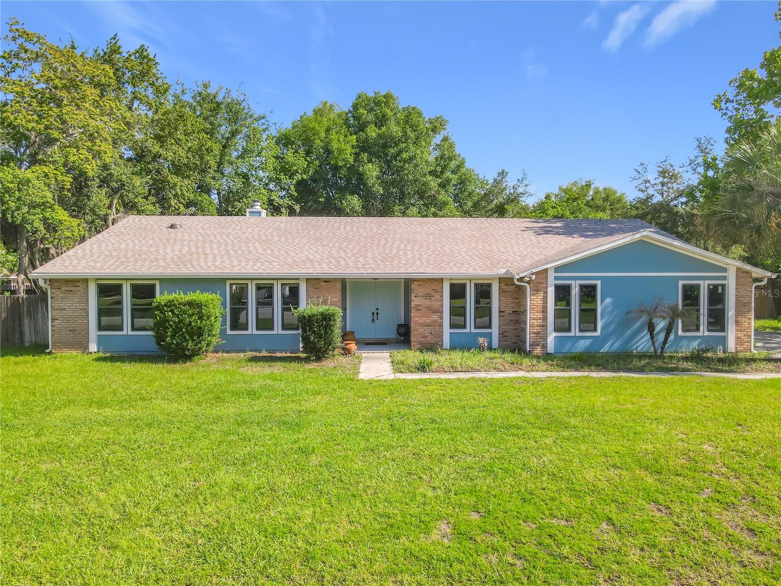 Looking For An Updated Home In DeBary’s Desirable Summerhaven Community? This Is The One. Welcome To This Move-In Ready 4 Bedroom/2 Bath Home In A Great Location. From The Front Path, Stepping Into The Home You Will See The Living And Dining Rooms. Continuing Further You Will Find The Spacious Family Room With Vaulted Ceilings, Natural Light, And A Cozy Wood-Burning Fireplace Creating A Comfortable Entertaining Space With Sliding Glass Doors Leading To A Large Screened Lanai Overlooking The Expansive Backyard (Over ½ Acre) With Room To Imagine A Pool, Garden, Or Extended Outdoor Living Space. The Updated Kitchen Opens To The Family Room And Features Granite Countertops, Stainless Steel Appliances, A Cooktop, Double Oven, Breakfast Bar, And Even Some Additional Space To Use For A Breakfast Nook. The Split Floor Plan Places 3 Bedrooms And A Full Bath On One Side Of The Home, While The Spacious Primary Suite On The Opposite Side Of The Home Offers Privacy, Oversized Sliders To The Backyard, A Large Walk-In Closet With A Separate Office Or Flex Space, And A Custom Primary Bath Which Is A Spectacular Showpiece, Featuring An Expansive Open Shower With Frameless Glass, Designer Tile, A Large Picture Window, Dual Sinks, Vanity Space, And Custom Cabinetry That Gives The Room A Spa-Like Feel. Many Updates and extras Include A New Roof (2025), Most Windows Replaced With Pella Vinyl Double-Pane Windows, Newer AC, Water Heater, Drain Field, Updated Carpeting, Bamboo Flooring, And Several Solar Tubes. A Side-Entry 2-Car Garage And Large Driveway Add Curb Appeal And Plenty OF Parking Space. This 4-Bedroom Home In DeBary Is Close To I-4, Hospitals, Shopping, Dining, SunRail, Downtown Sanford, Historic Downtown DeLand, The St. Johns River, And Daytona And NSB Beaches. Schedule Your Private Showing Today. With Over Half An Acre, Split Floor Plan, Updated Kitchen, Screened Lanai, And A Bright Primary Suite With Backyard Access, How Could You Miss Seeing This Home?