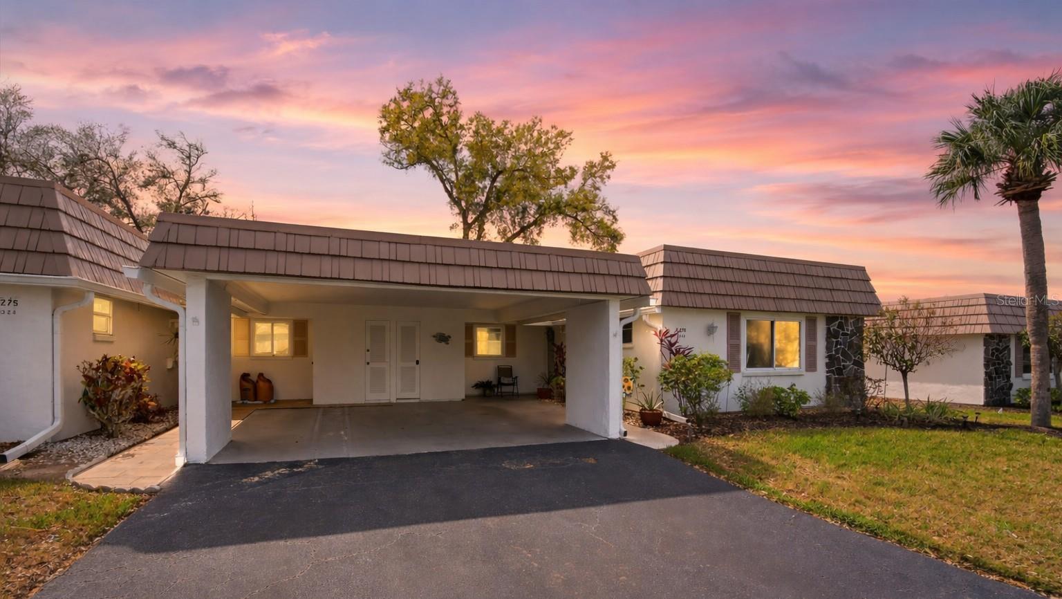Welcome to easy Florida living in this 2-bedroom, 2-bath 55+ villa in beautiful Sarasota just 15 minutes away from Siesta Key! Comfortable, bright, and thoughtfully designed and NEW Roof and HVAC (2024) for added peace of mind - Come enjoy the relaxed lifestyle Sarasota is known for.
Step inside to discover tile flooring throughout the entire home — no carpet here, creating a low-maintenance living space that’s perfect for Florida living. The stylish kitchen features rich wood cabinetry, granite countertops, a beautiful backsplash, and stainless steel appliances, offering both charm and functionality for everyday cooking and entertaining. Just off the kitchen, the sunny dining area is filled with natural light thanks to two large sliding glass doors, making it a welcoming place to start your morning or gather with friends.

The spacious great room provides plenty of room to relax or host guests, with an open feel that makes the home comfortable and inviting. Both bedrooms are nicely sized, including the primary suite with a walk-in closet and private bath, offering a peaceful retreat at the end of the day. A laundry room conveniently located just off the 2 car carport adds everyday ease and practicality.

Life in Strathmore Riverside Villas is about more than just the home — it’s about the lifestyle. Residents enjoy a wide variety of amenities designed for both relaxation and connection. The clubhouse serves as the heart of the community, featuring a fitness room, library, billiards, ping-pong, and outdoor recreation areas. A large heated pool is perfect for lap swimming, exercising, or simply relaxing in the Florida sunshine.
Even better, the monthly condo fees make living here simple and stress-free, covering exterior maintenance, grounds care, water, and cable. Owners only pay for electricity and internet, allowing you to spend more time enjoying the Sarasota lifestyle and less time worrying about upkeep.

For those who love being near the water, the community offers day docks for launching kayaks and fishing, along with a marina where owners can rent boat slips on a first-come basis. The social calendar stays active year-round with dances, dinners, educational luncheons, game nights, and community gatherings. Residents can also participate in a variety of social clubs including golf, arts and crafts, cards, boating, dining groups, and more, making it easy to meet neighbors and stay involved.

Living in Sarasota means enjoying one of Florida’s most beloved coastal destinations. Known for its beautiful Gulf Coast lifestyle, Sarasota offers an incredible mix of award-winning beaches, dining, and outdoor recreation. Just a short drive away is the famous Siesta Key Beach, celebrated for its powdery white quartz sand and stunning sunsets. Spend your days soaking up the sunshine or enjoying waterfront restaurants in Siesta Key Village.

Sarasota is also known for its vibrant cultural scene, including theaters, museums, and waterfront parks, along with endless opportunities for boating, fishing, golf, and exploring the natural beauty of Florida’s Gulf Coast. Whether you’re enjoying a quiet morning coffee at home, joining neighbors for a social event, or heading out to the beach for the afternoon, life here offers the perfect balance of relaxation and activity.

If you’ve been searching for a welcoming 55+ community, fantastic amenities, and the Sarasota lifestyle close to Siesta Key, this villa is ready to welcome you home.