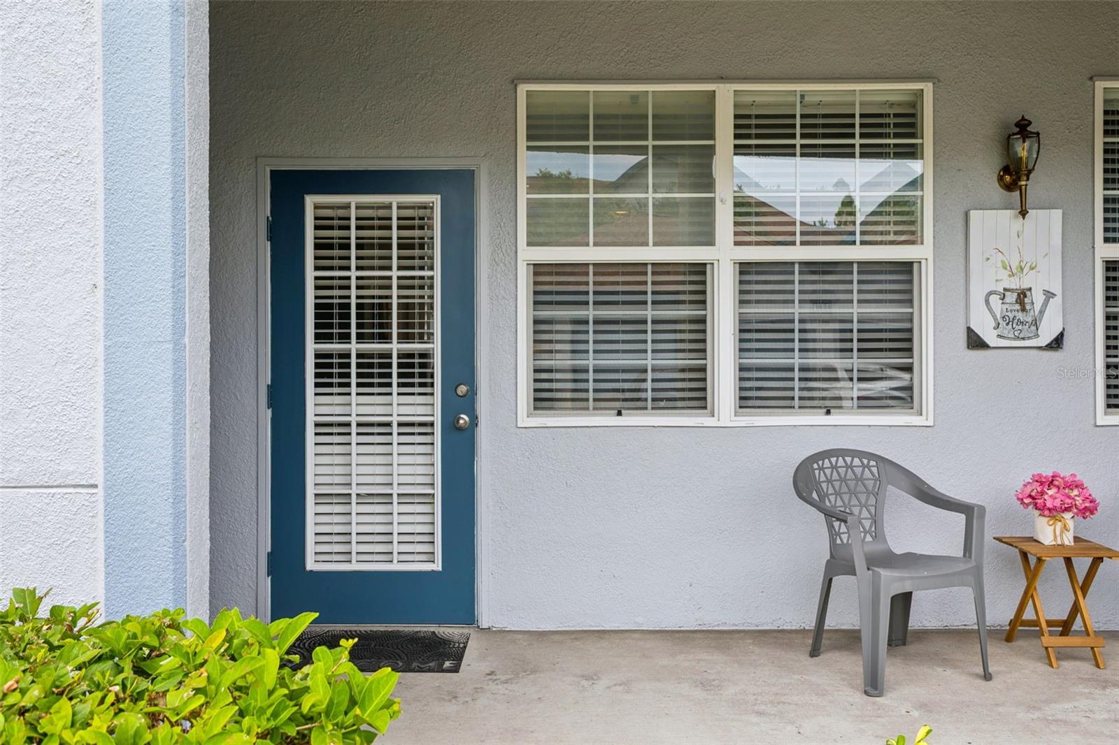 Virtually Staged. Great Location, Resort-Style Amenities, Move-In Ready! Welcome to this delightful FIRST FLOOR condo with 1 Bedroom / 1.5 Baths +  French Door Rear Entry + charming PATIO/PORCH with 2 Storage Closets. The OPEN FLOORPLAN offers a natural flow between Living Room/Dining Area - perfect for everyday living or entertaining guests. Kitchen features BARSTOOL COUNTER, PANTRY closet, LAUNDRY closet with WASHER/DRYER included. GUEST HALF-BATH is conveniently located off Foyer. The Bedroom EnSuite features WALK-IN CLOSET, Spa-Like Bathroom with large oval Tub & Shower. No Carpet! Neutral Tile and Easy-Care Laminate flooring throughout. Enjoy 2 Community POOLS, FITNESS Center, Sauna, Clubhouse with Library, Media Room, Kitchen facilities and more! LOW Monthly Maintenance Fee includes INTERNET/WiFi/Cable, WATER & Sewer, VALET Trash Pickup at your door, exterior building maintenance, ROOF, grounds maintenance. Convenient Suncoast Parkway, I-75, major commute routes. Just minutes to upscale shopping, outlet stores, restaurants. 45 minutes to Tampa Airport. Come enjoy the good life! WELCOME HOME.